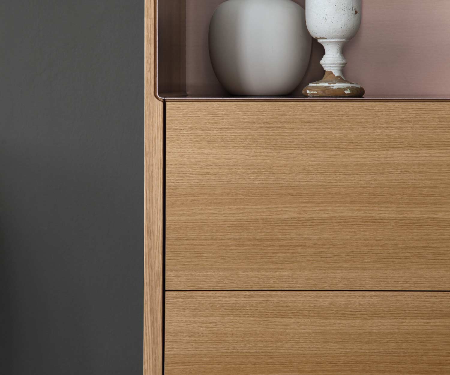 Modern design high chest of drawers Detail open compartment on top with vases and crockery