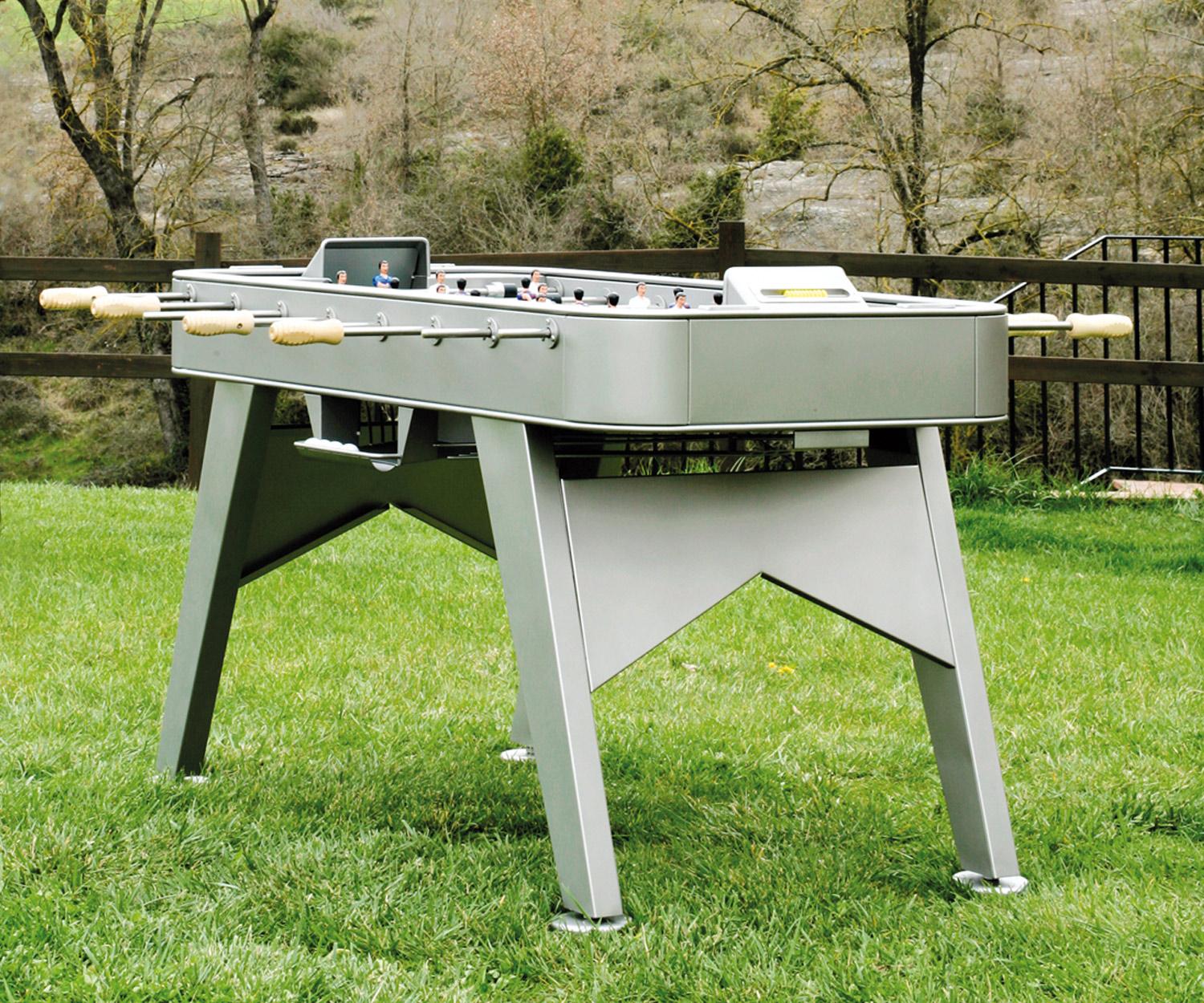 Designer foosball table from RS Barcelona in the garden on the lawn Designer foosball table from RS Barcelona in the garden on the lawn