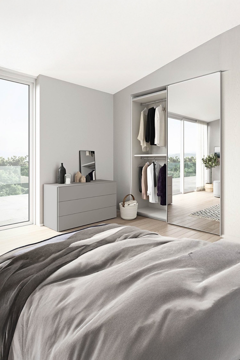 kleiderschrank-mit-spiegeltuer-und-kommode-mit-standspiegel-in-einem-gemuetlich-eingerichteten-schlafzimmer