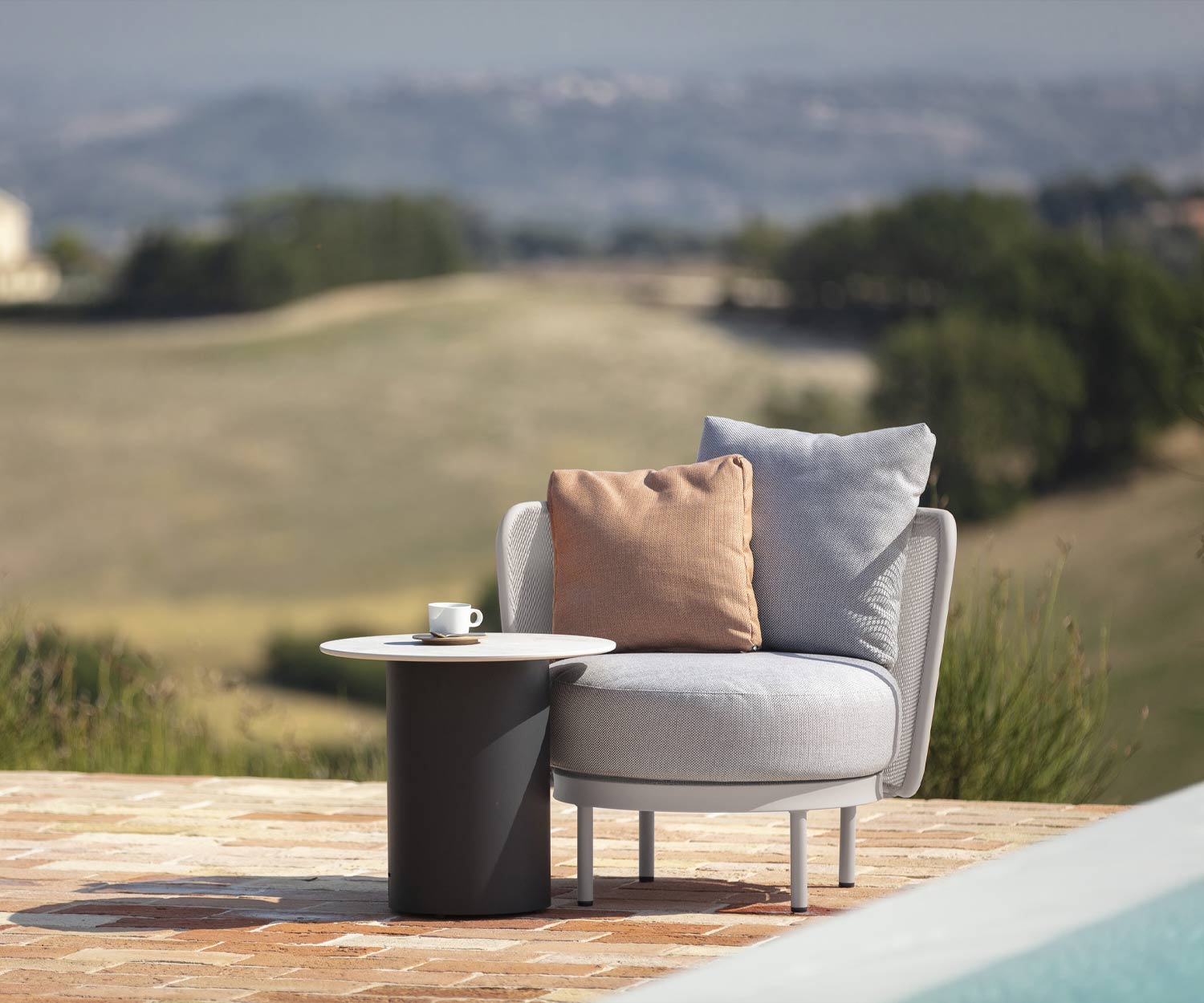 Exclusive Todus Baza Round Design club chair by the swimming pool