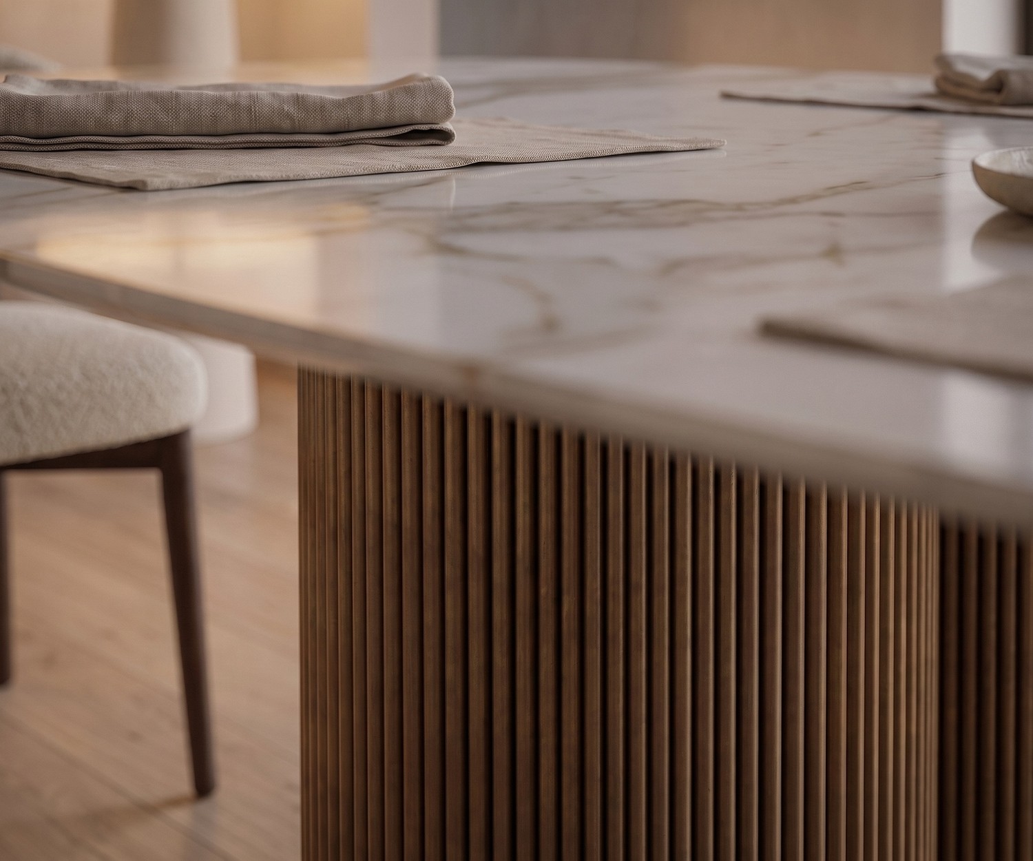 al2 dakry b 001 dining table in a dining room, featuring a marble-look ceramic top and fluted wooden pedestal base.