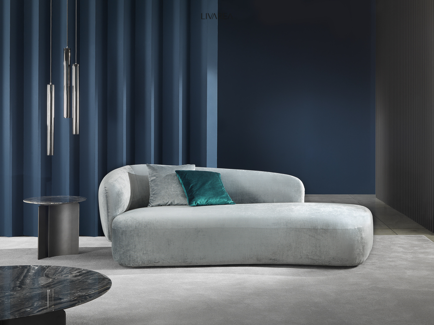 Elegant recamier sofa with velvet upholstery rounded design combined with round marble side table Elegant recamier sofa with velvet upholstery rounded design combined with round marble side table