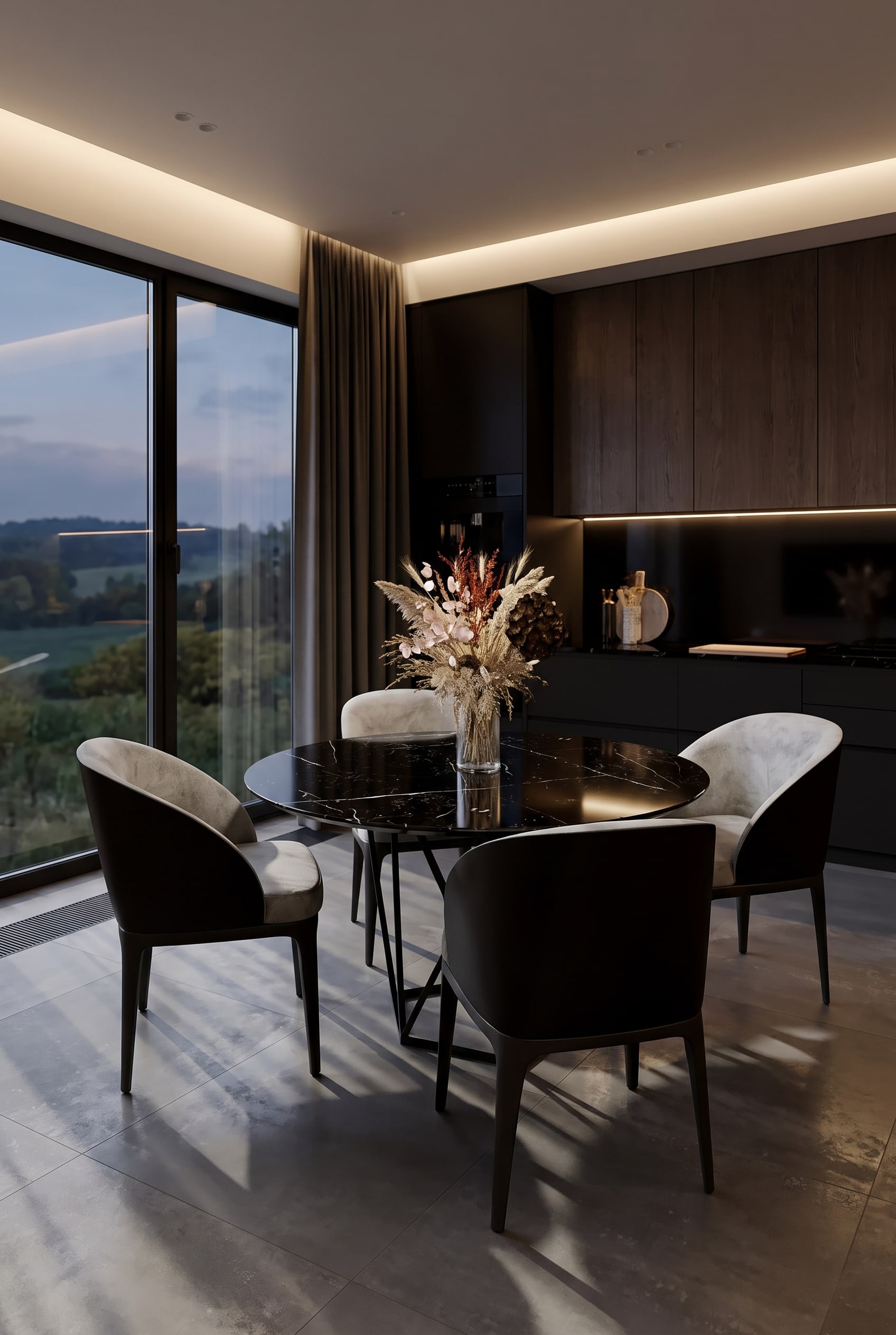 Luxurious dining room with a round dark marble-look dining table Tatlin, four velvet chairs and a dried flower arrangement