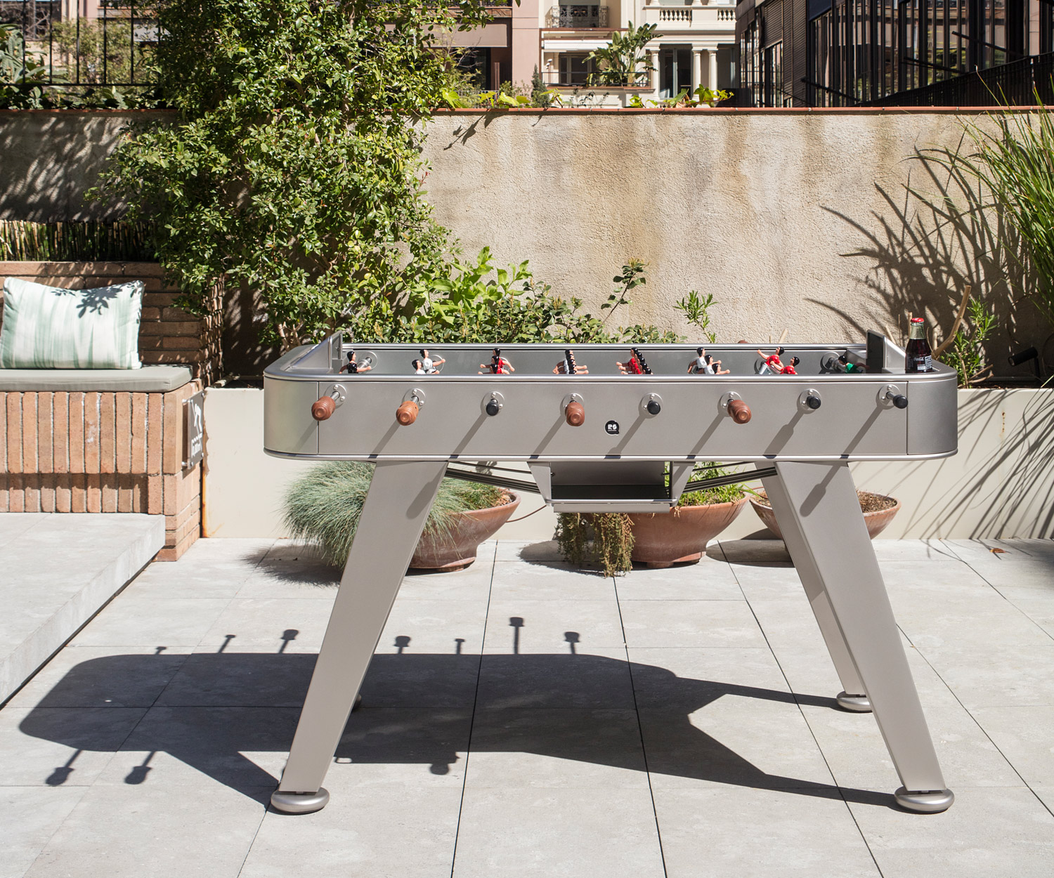 Silver-coloured RS Barcelona foosball table on the terrace Silver-coloured RS Barcelona foosball table on the terrace