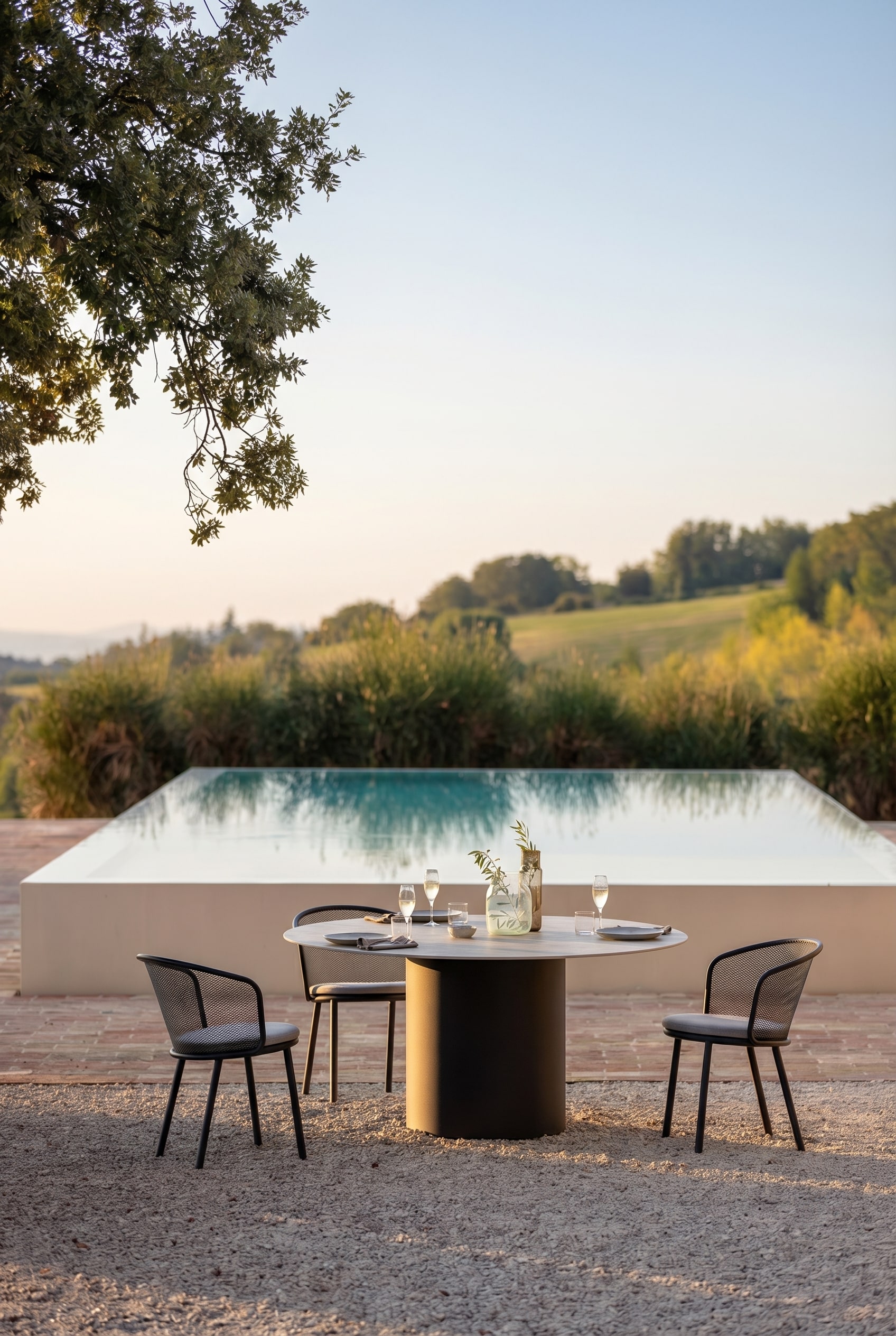 Elegant garden table with a round ceramic top and dark pedestal Elegant garden table with a round ceramic top and dark pedestal