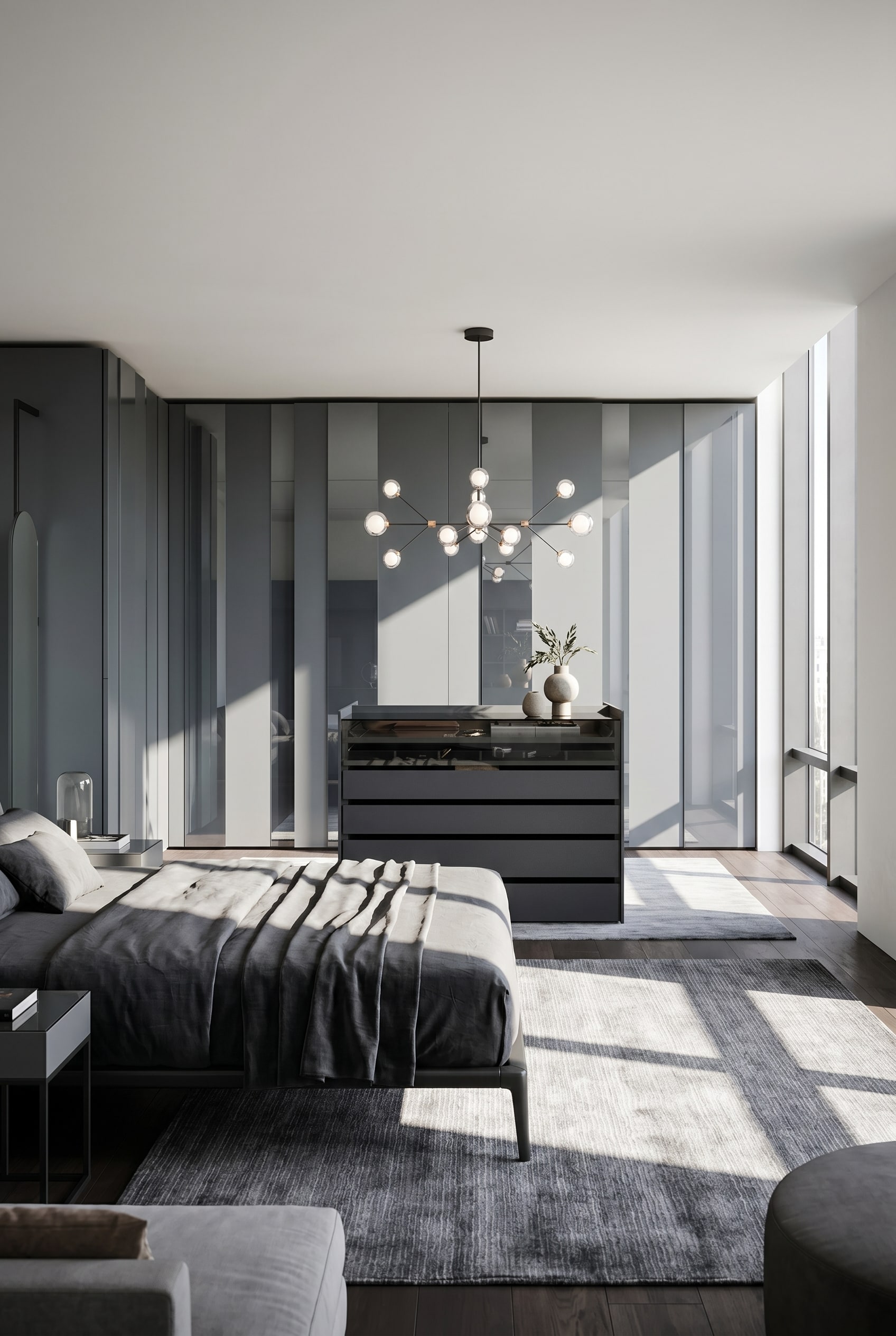 Elegante isola armadio scura con copertura in vetro e cassetti al centro di una luminosa cabina armadio con pavimento in terrazzo