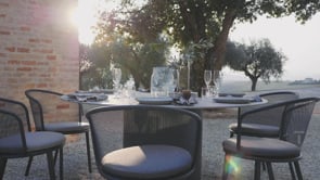 Exclusive Todus Branta Design round dining table by the swimming pool on the terrace