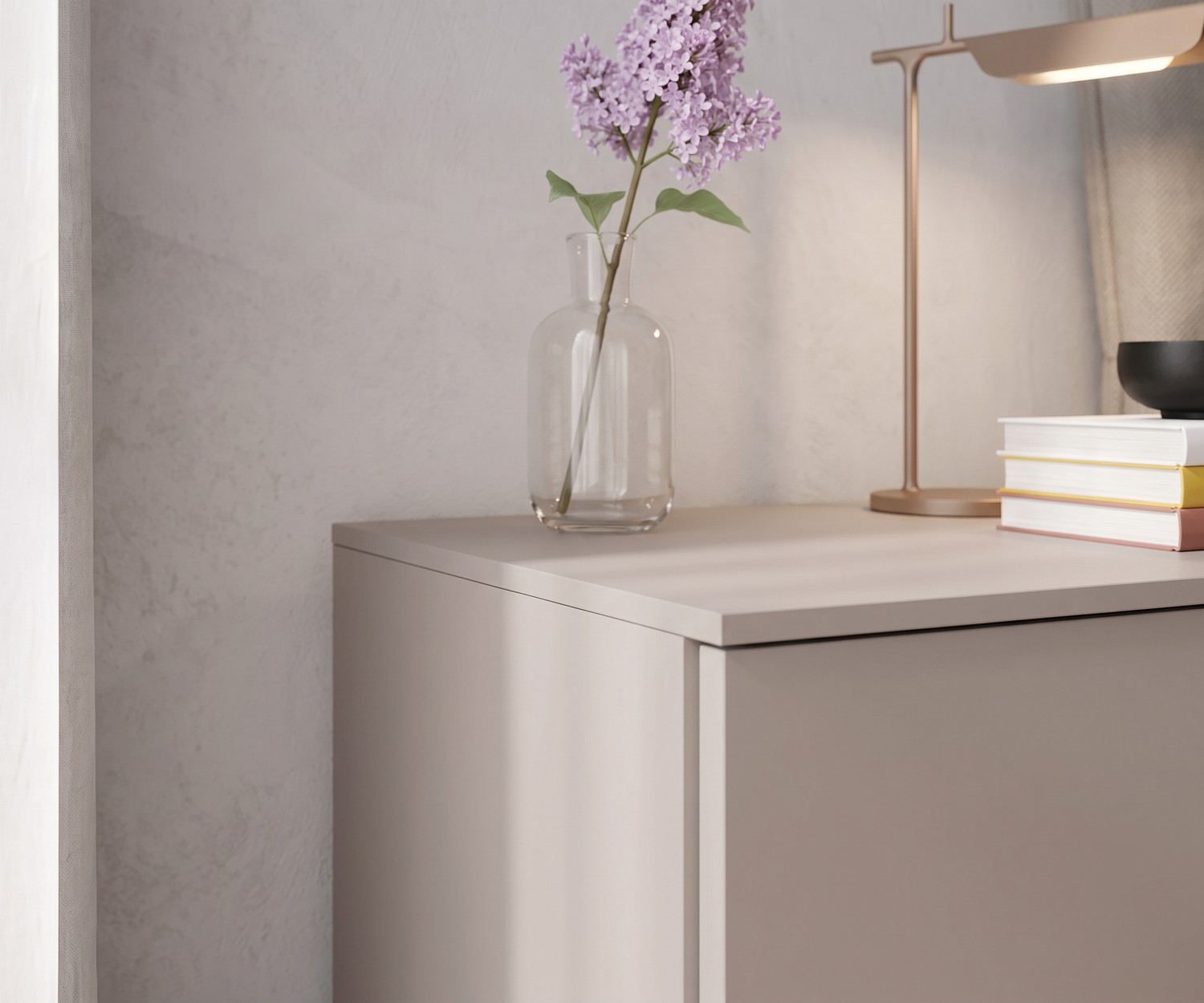 Atena bedside table by Livitalia in matt beige, decorated with a flower vase and a table lamp in a modern bedroom.