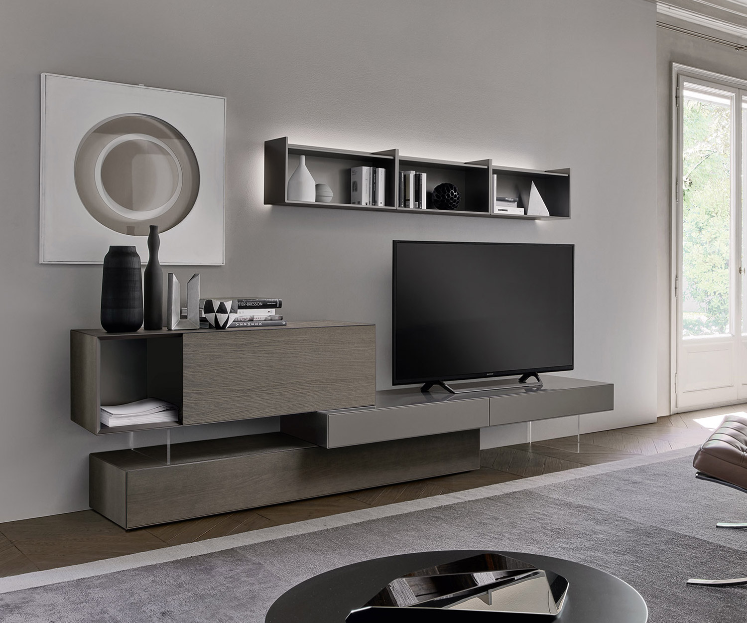 Exclusive Livitalia design wooden wall shelf above floor-standing design lowboard in the living room