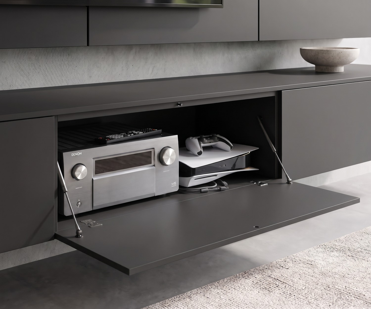 Livitalia C102 wall-mounted TV lowboard in anthracite with open drop-down door for media devices in a modern living room.