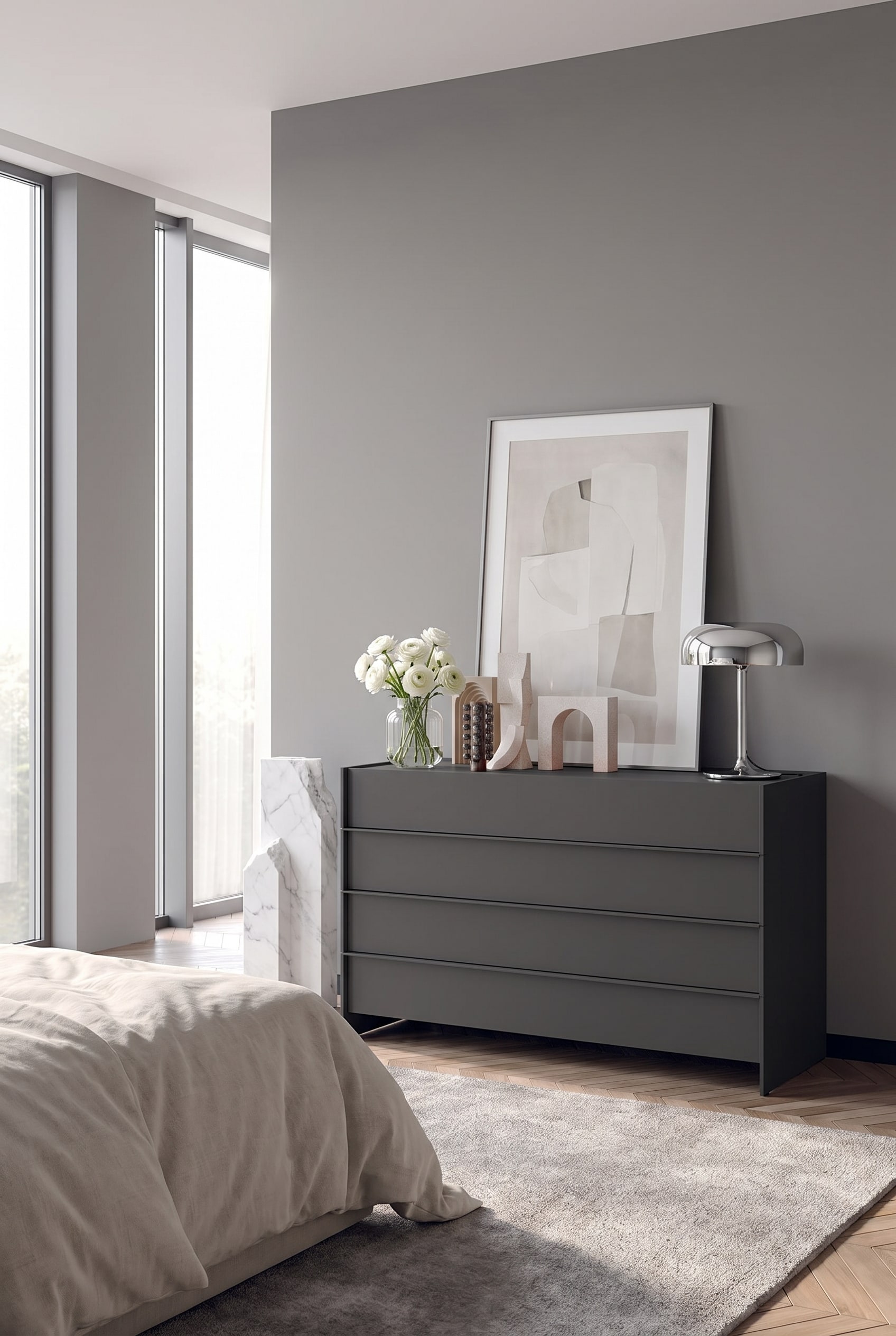 Comò minimalista senza maniglie in grigio chiaro, che si fonde tono su tono con la parete della camera da letto
