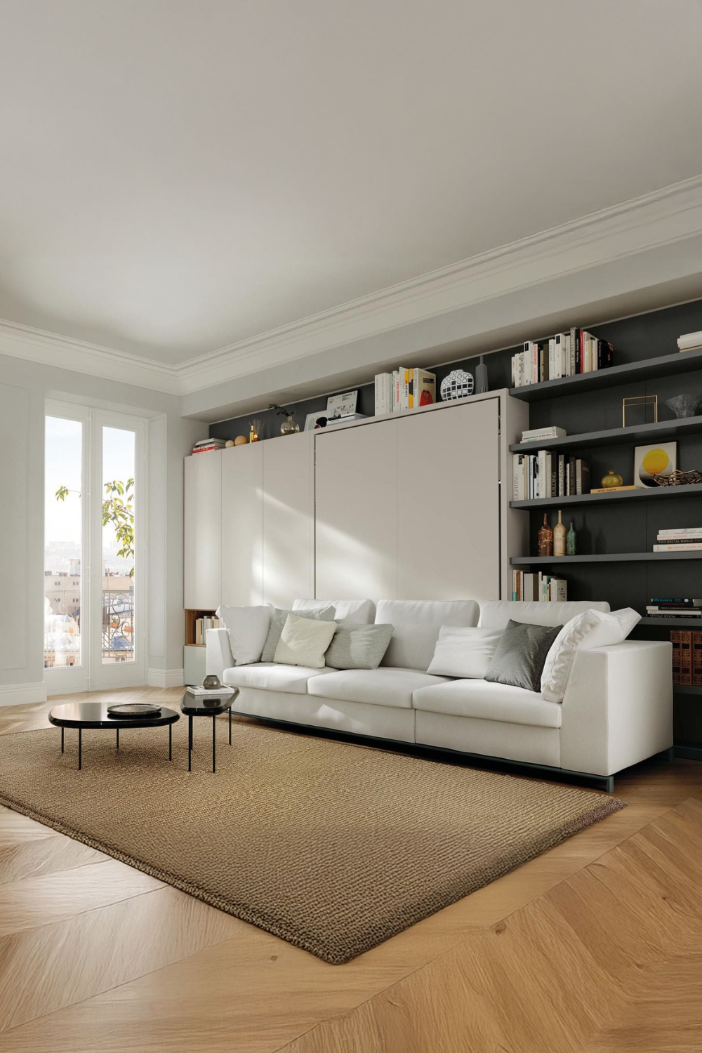 puristisch-weisses-schrankbett-mit-grossem-sofa-und-zwei-dunklen-tischen