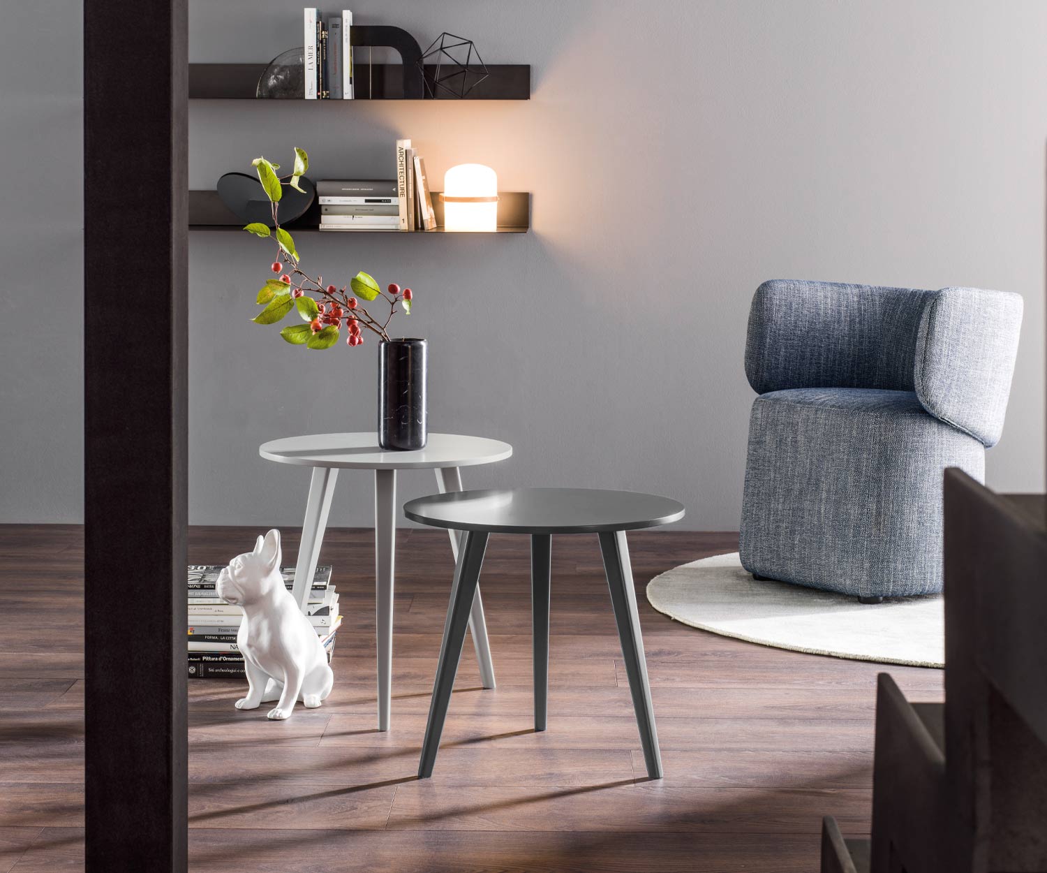 Light grey black Novamobili Design Trio table in the living room with three legs Light grey black Novamobili Design Trio table in the living room with three legs