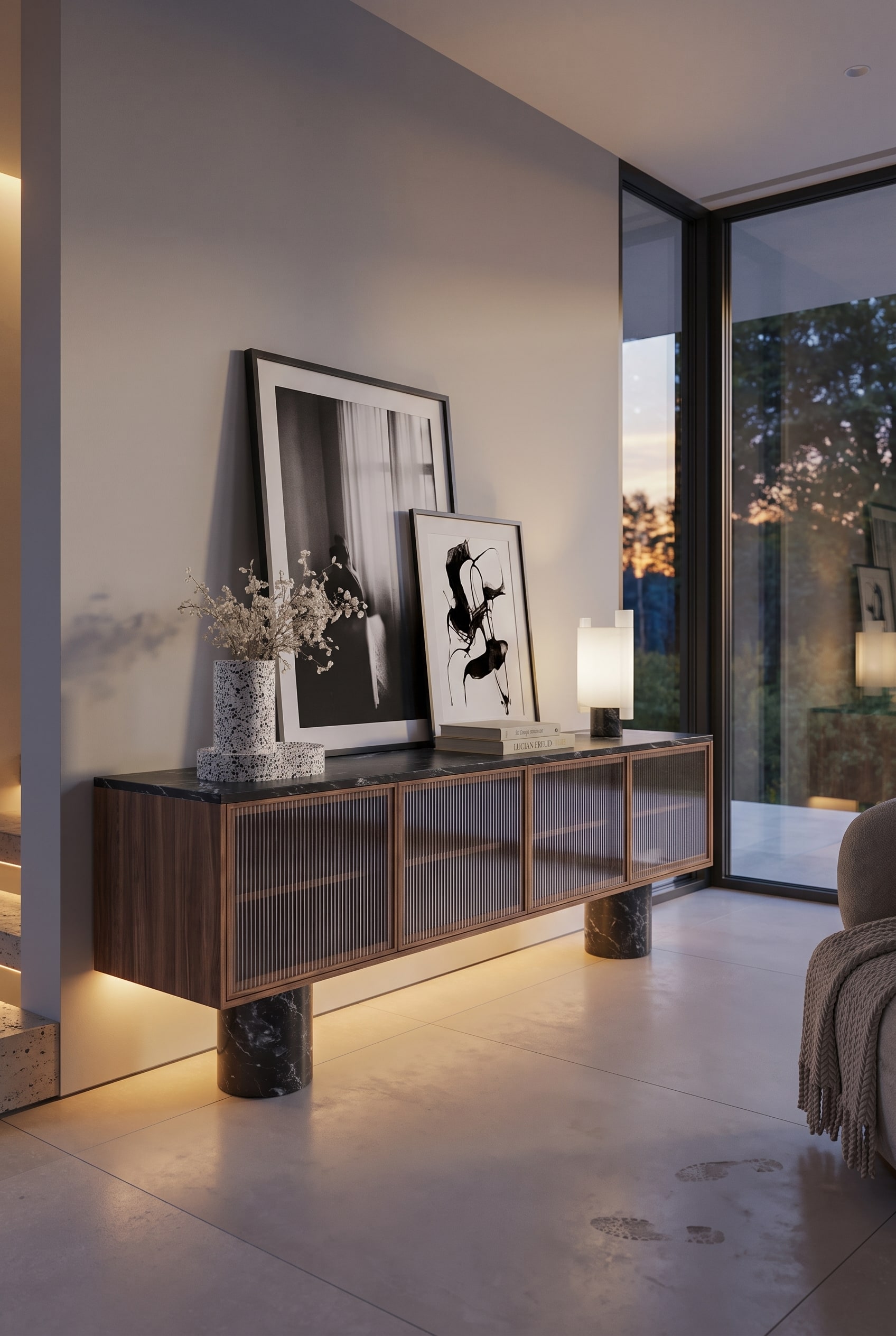 A framed picture leans against the wall on the structured Punt Rio Sideboard, with a smaller framed picture slightly overlapping in front of it.