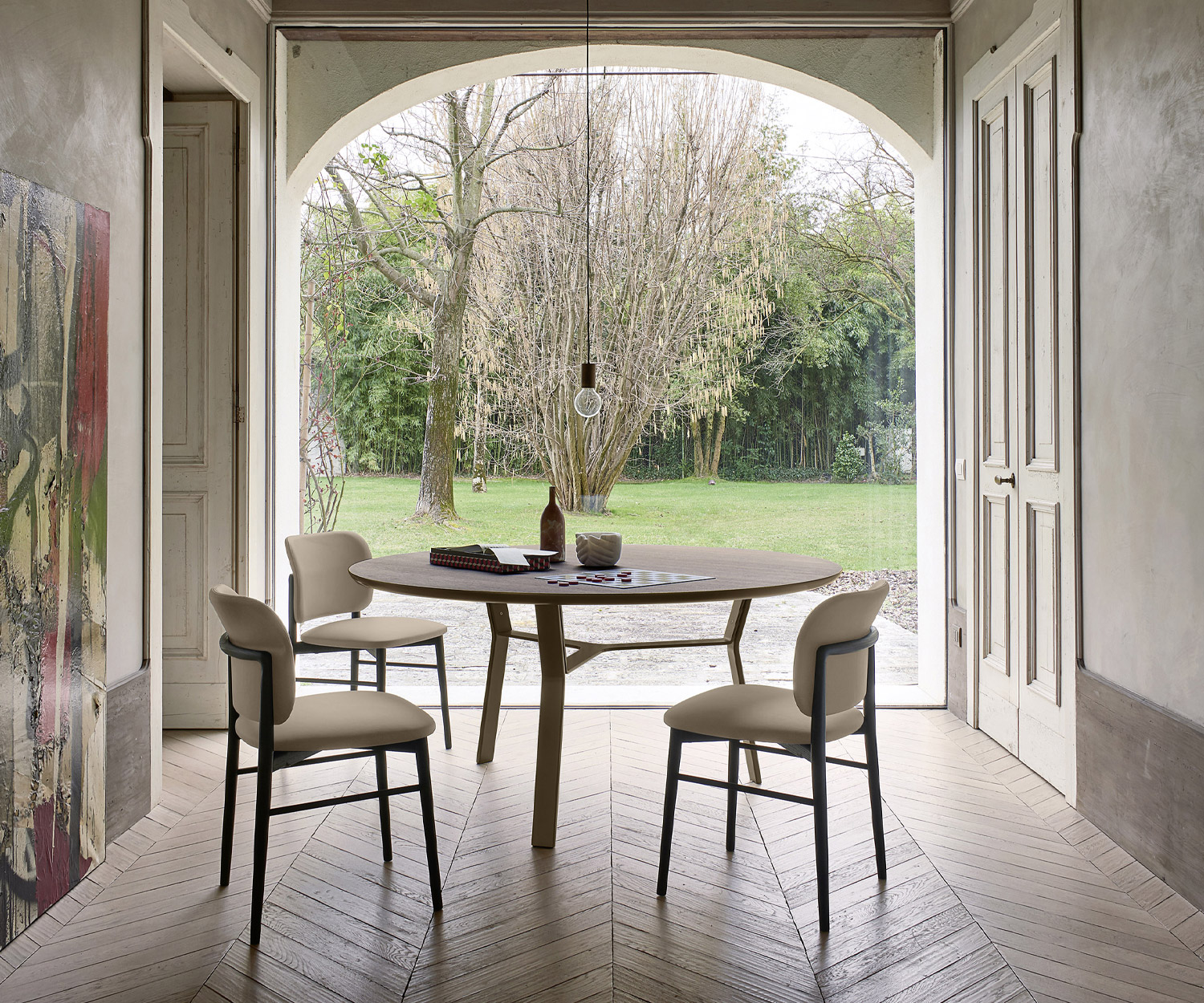Modern Livitalia Iron dining table round table top with optional swivel top in the dining room Modern Livitalia Iron dining table round table top with optional swivel top in the dining room