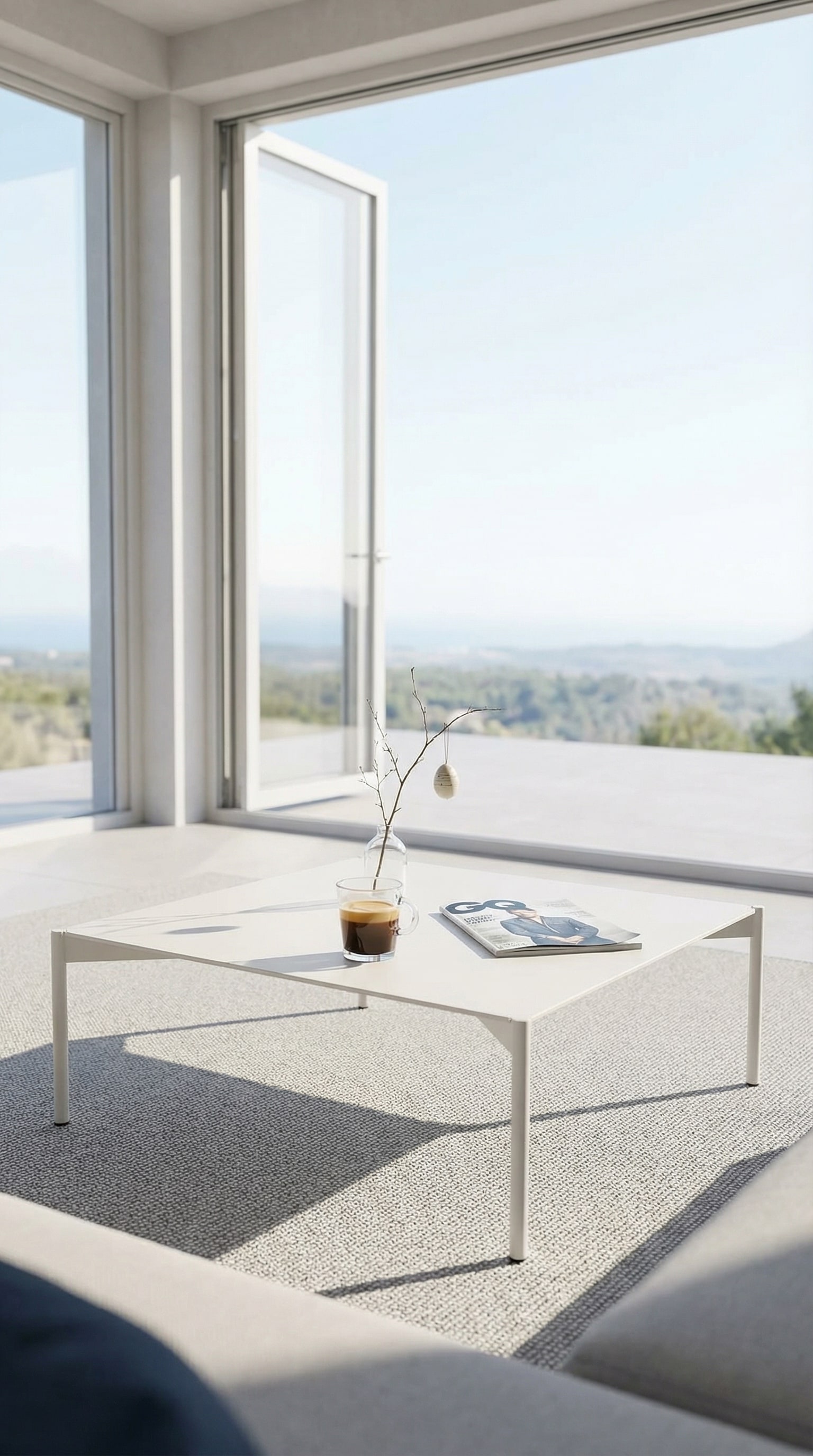 Flat puristic outdoor coffee table on a bright sun terrace