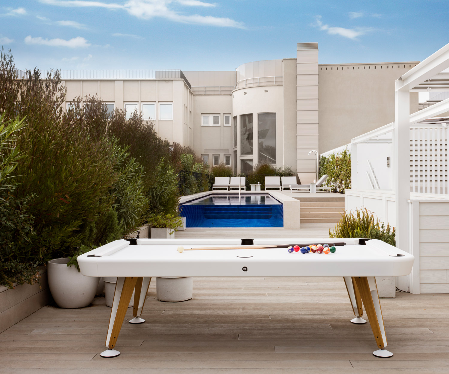 White table for billiards outside on stone terrace