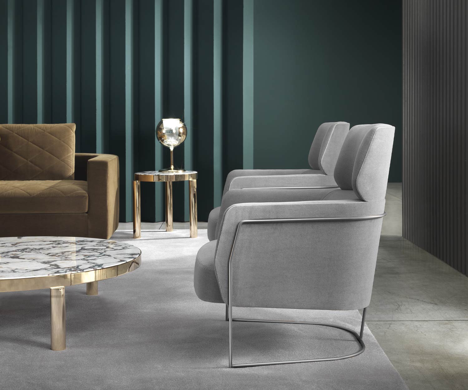 Grey Marelli Nest Relax armchair on narrow legs in the living room Grey Marelli Nest Relax armchair on narrow legs in the living room