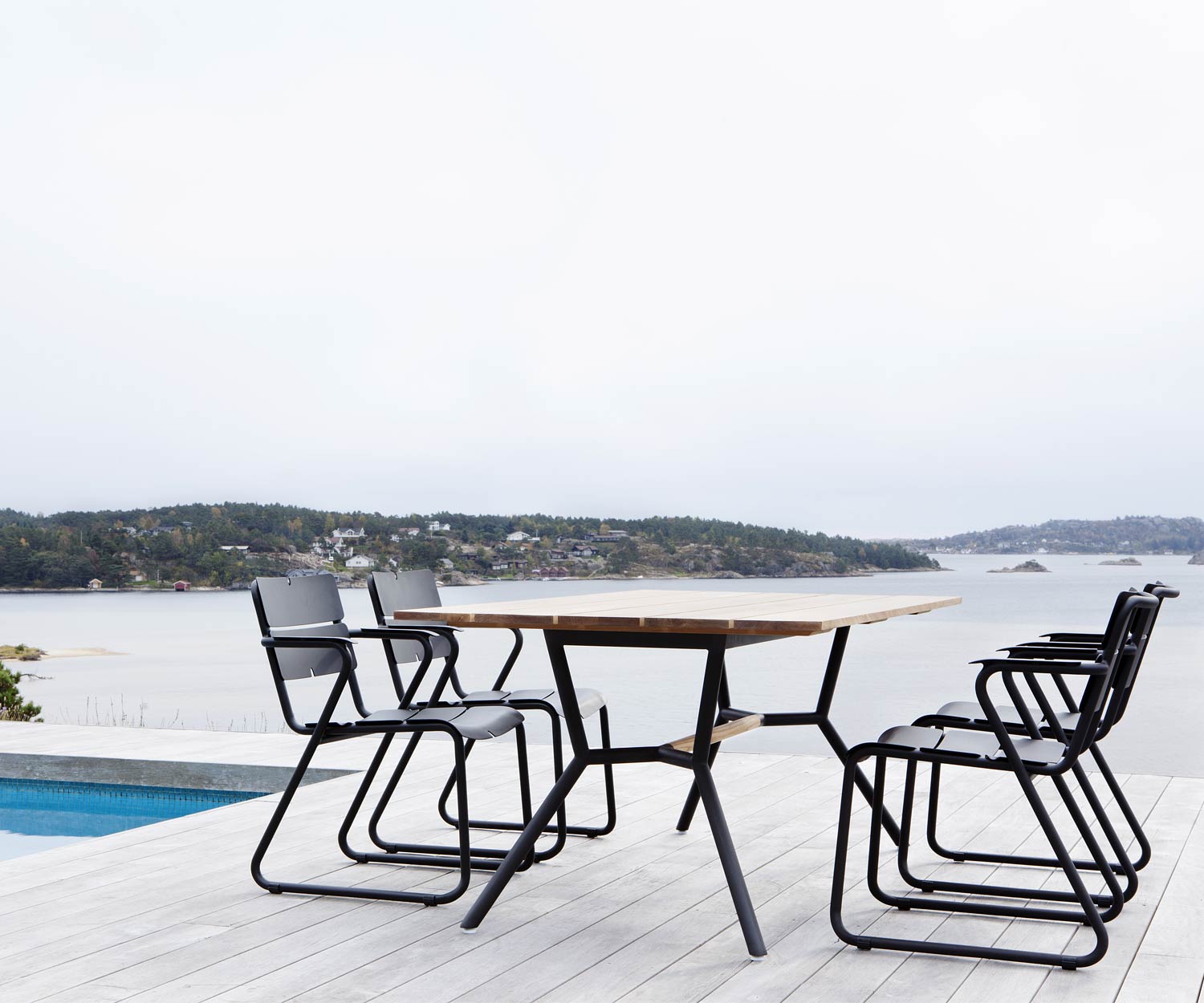 Exklusiver Oasiq Corail Design Armlehnenstuhl mit Reef Tisch