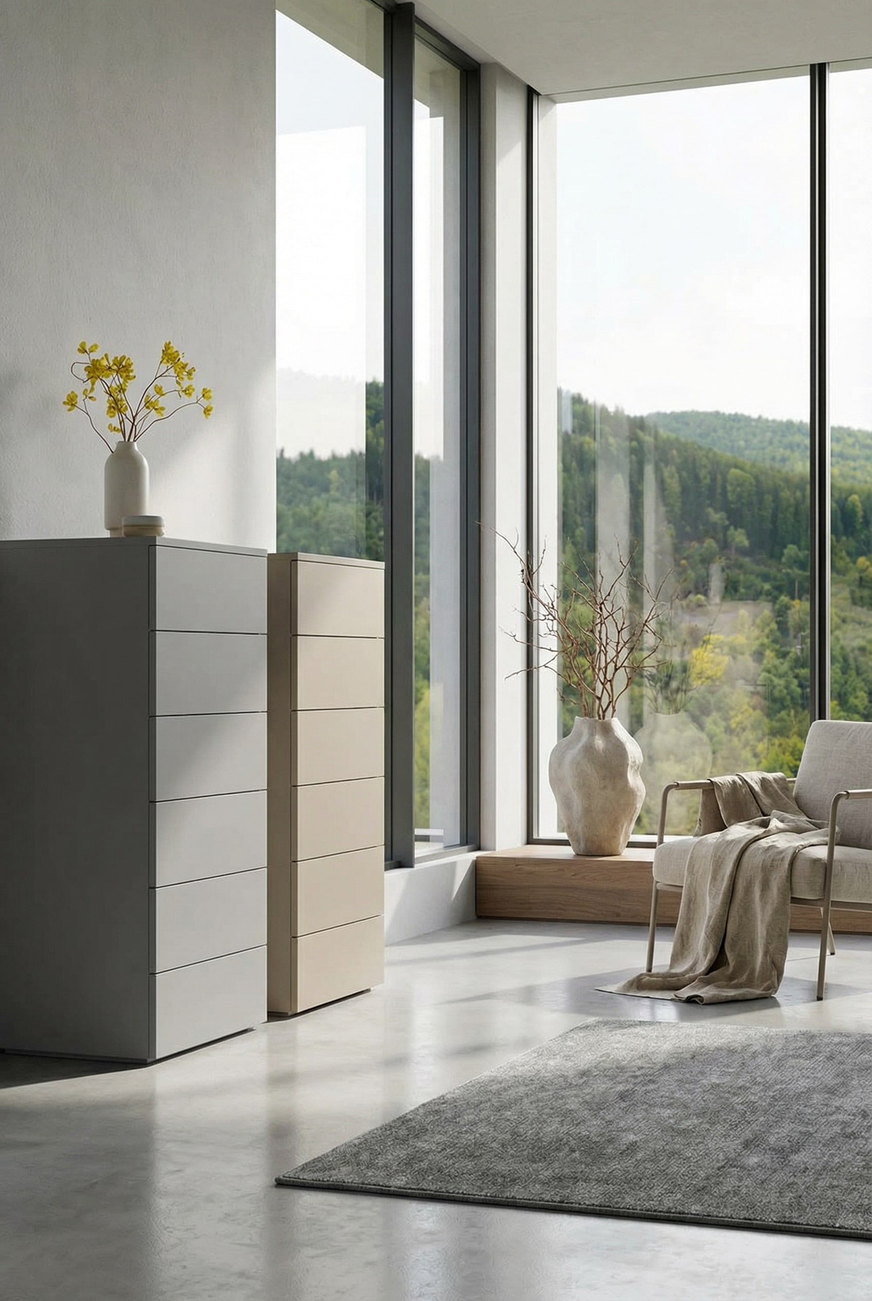 Minimalist white tall chest of drawers in a bright, sun-drenched room with floor-to-ceiling windows.