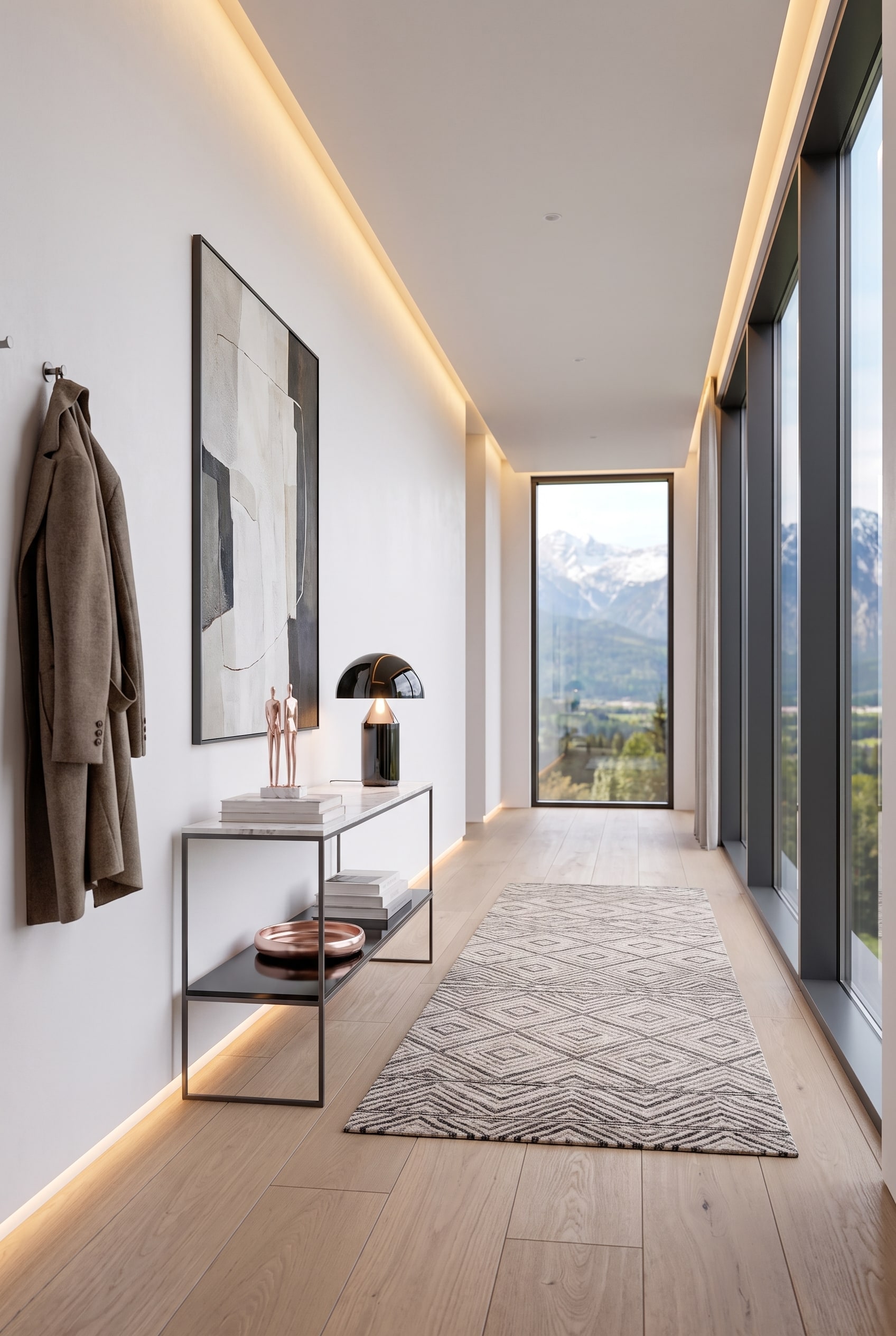 Ingresso moderno con console in metallo scuro e piano in marmo, con una lampada scultorea sopra, e grandi finestre sullo sfondo