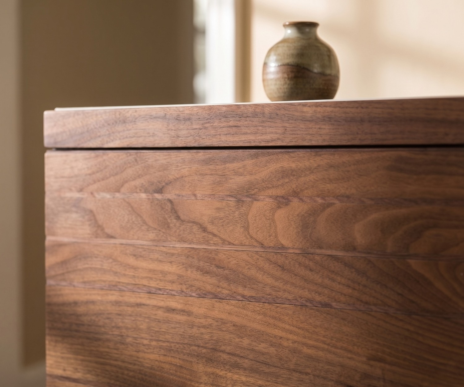 al2 o-rizon 003 design sideboard in walnut wood for the living room, close-up of the front with horizontal strip pattern.