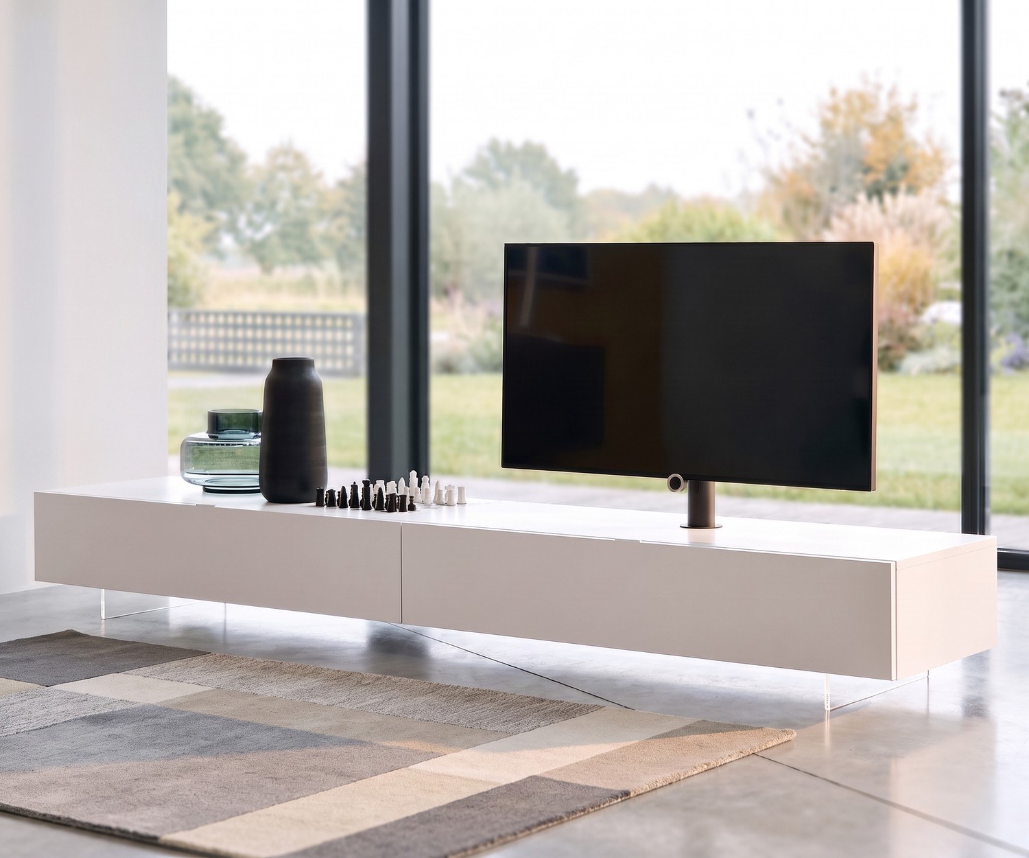 Livitalia transparent TV base for a floating TV lowboard in the living room, minimalist design made of methacrylate.