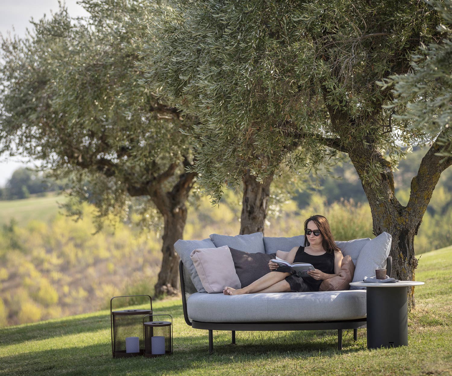 Shady spot with Todus Baza Round Designer Daybed under trees Shady spot with Todus Baza Round Designer Daybed under trees