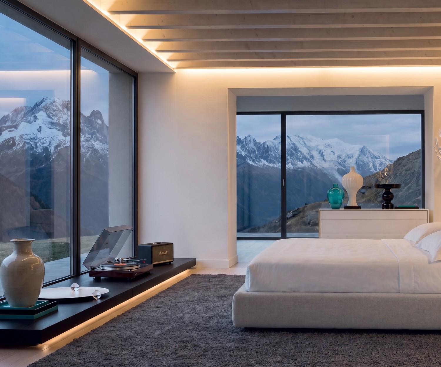 Livitalia EASY low bench plinth as a TV podium in a modern bedroom, dark wood finish with LED underlighting.