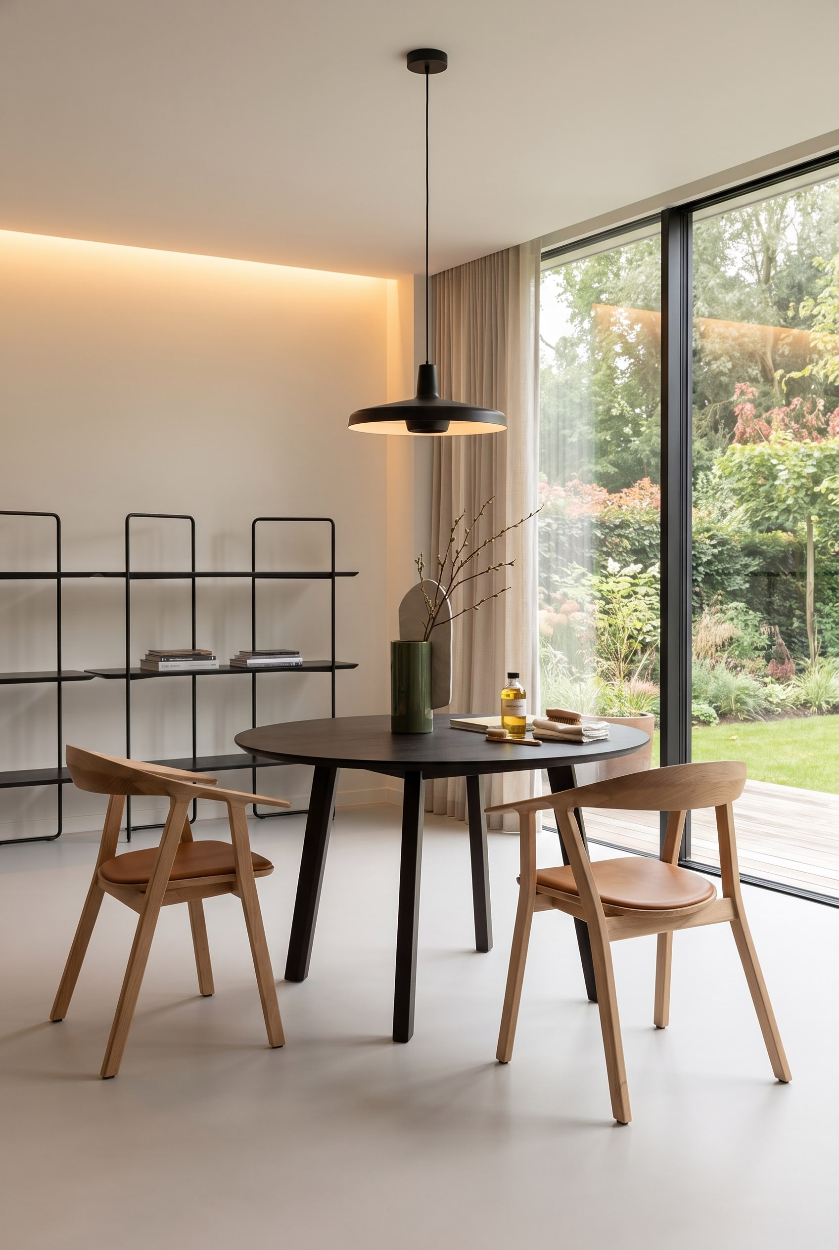 Minimalist dining room with solid oak Prostoria Rhomb dining table, wooden chairs with leather seats, and decorative designer vase