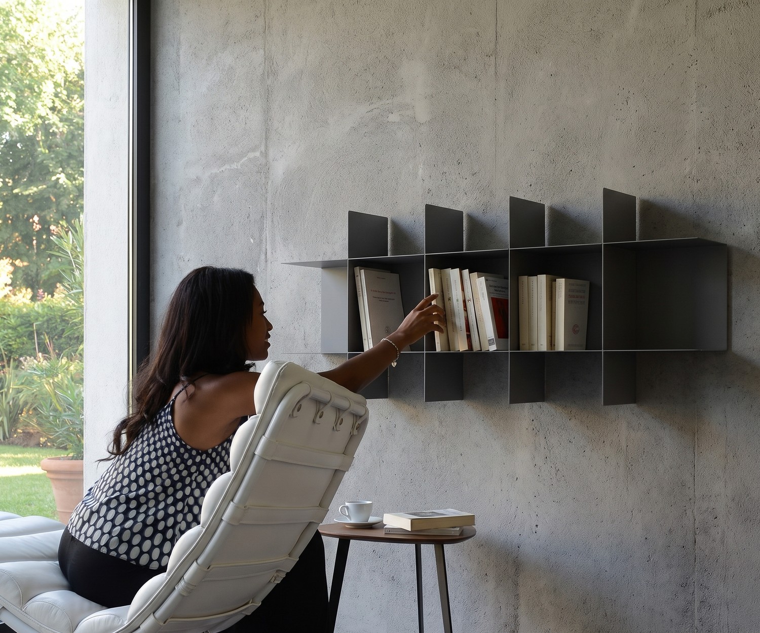 MEME Design Innesto Modular Metal Wall Bookshelf MEME Design Innesto modular metal wall bookshelf unit in a modern living room setting above a low sideboard.