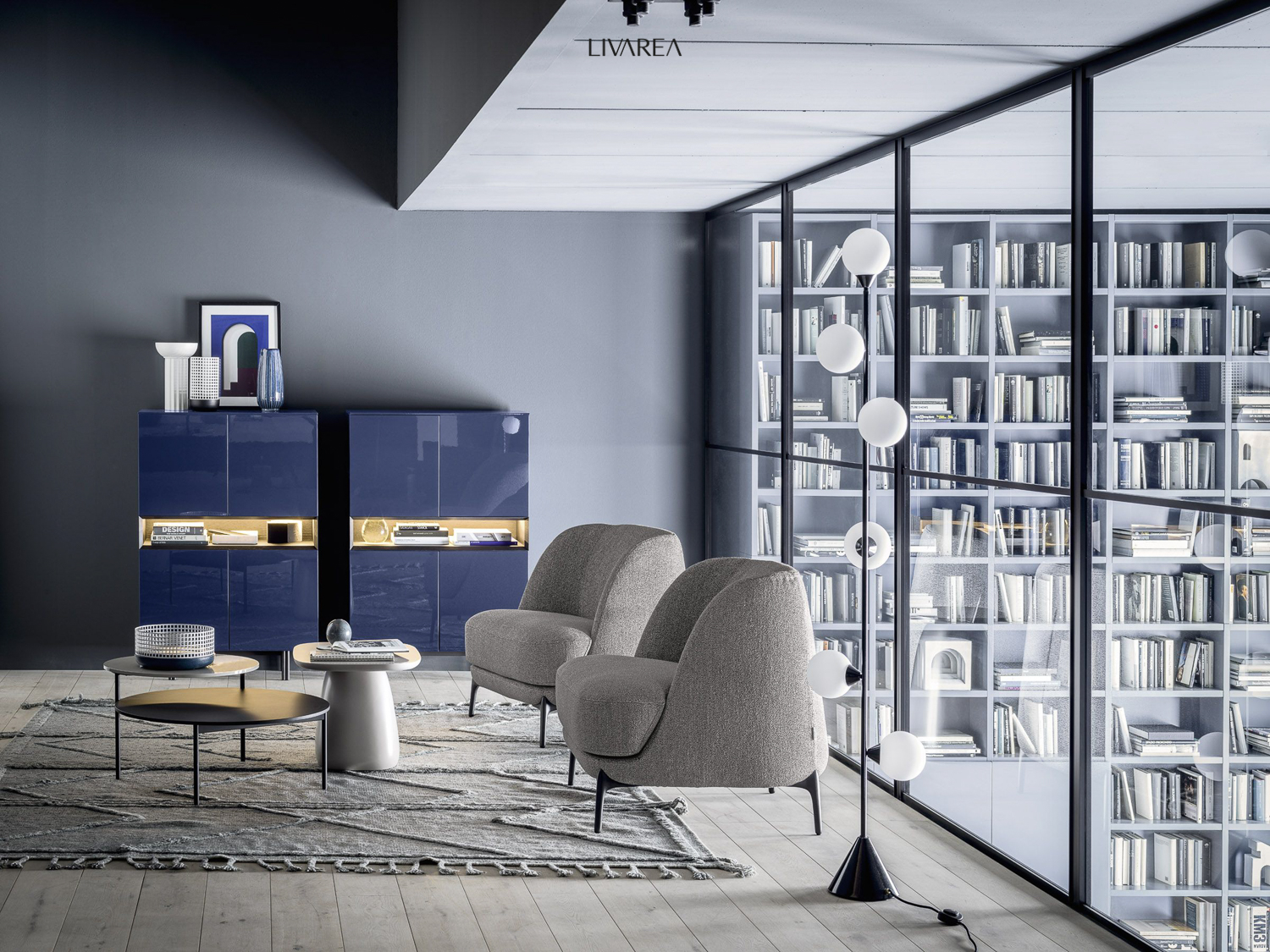 Cosy living area with armchair group and highboards Cosy living area with armchair group and highboards