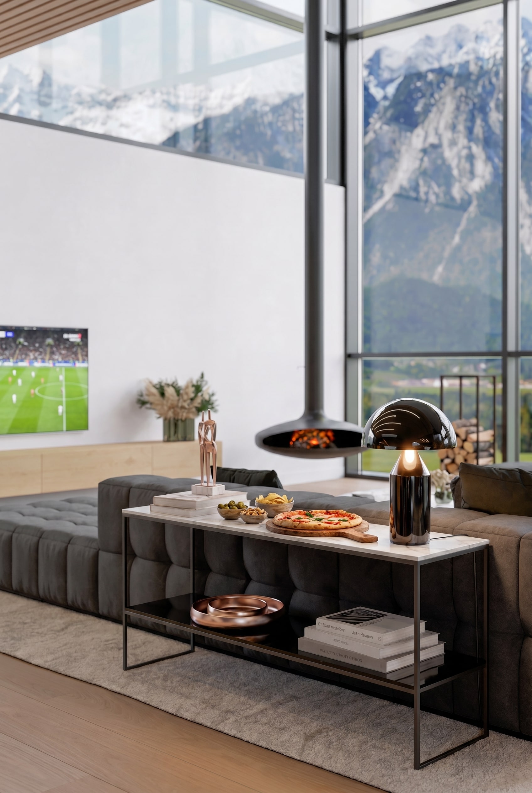 Console nera stretta posizionata dietro un divano freestanding in una lussuosa zona giorno, con libri illustrati impilati e una raffinata lampada da tavolo sopra