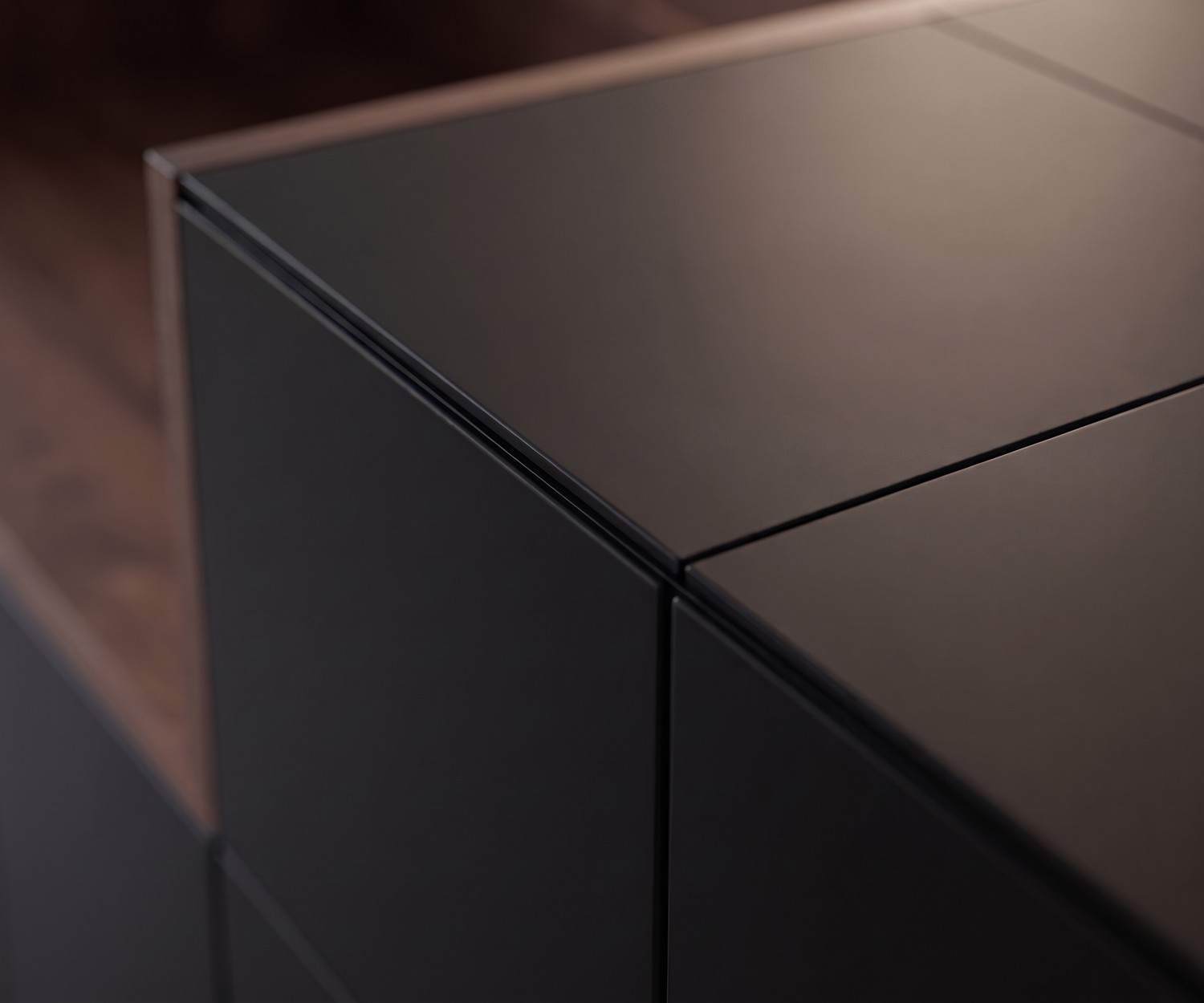 al2 MOS-I-KO 003 A sideboard in a living room, made of matte black lacquer and wood in a modern retro style.