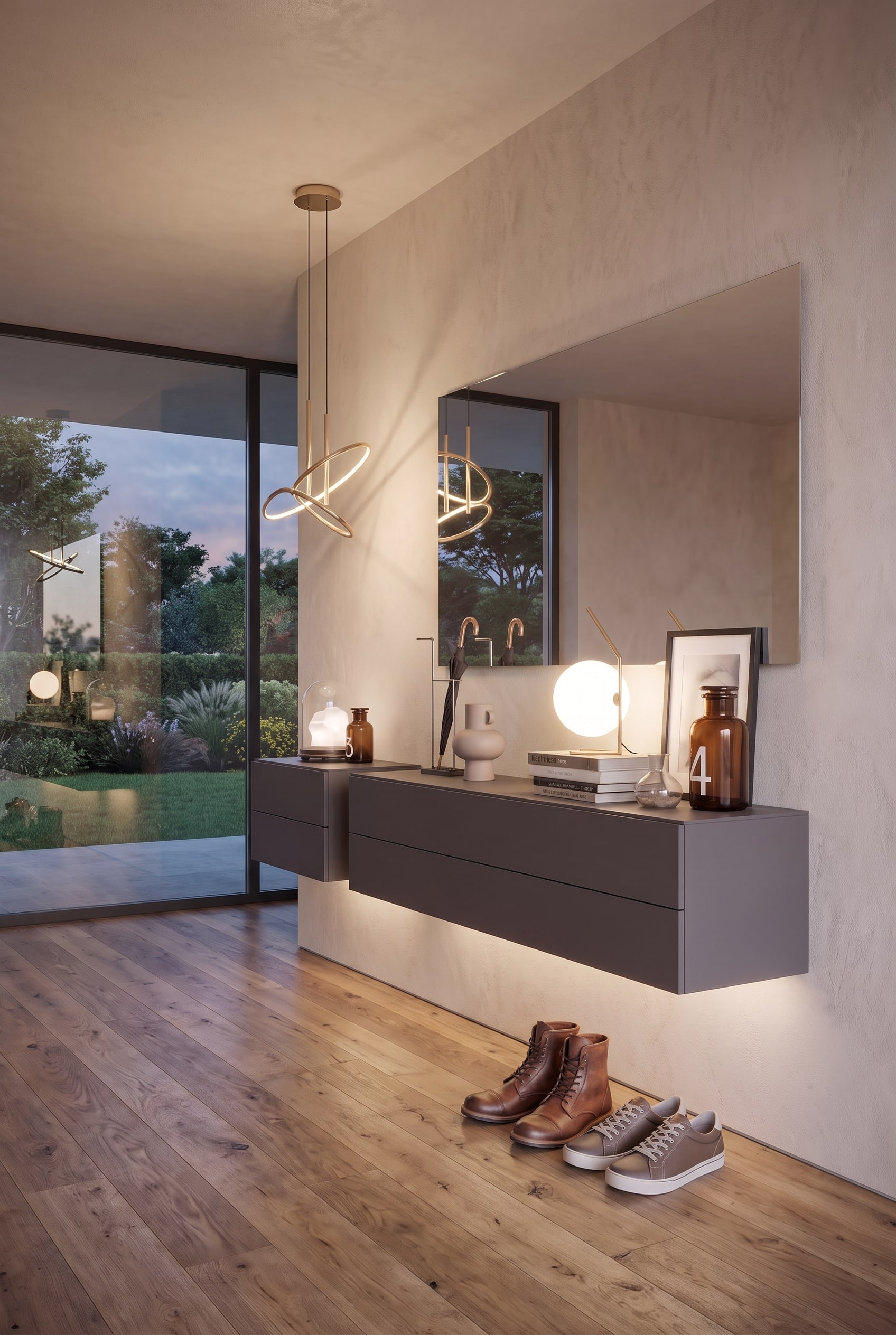 Corridoio moderno con cassettiera sospesa grigio scuro, specchio rettangolare a filo, lampade a sospensione astratte e scarpe in pelle.