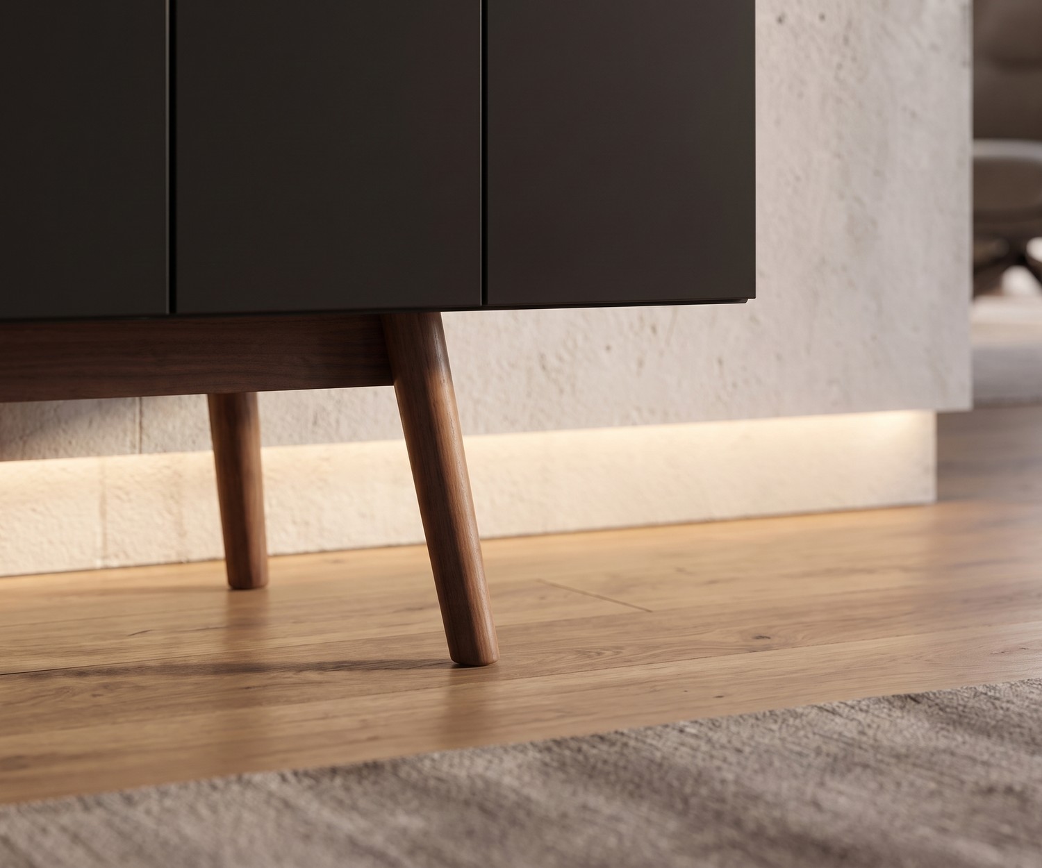 al2 MOS-I-KO 003 A living room sideboard, close-up of the retro wooden legs and dark grey cabinet doors on wooden floor.