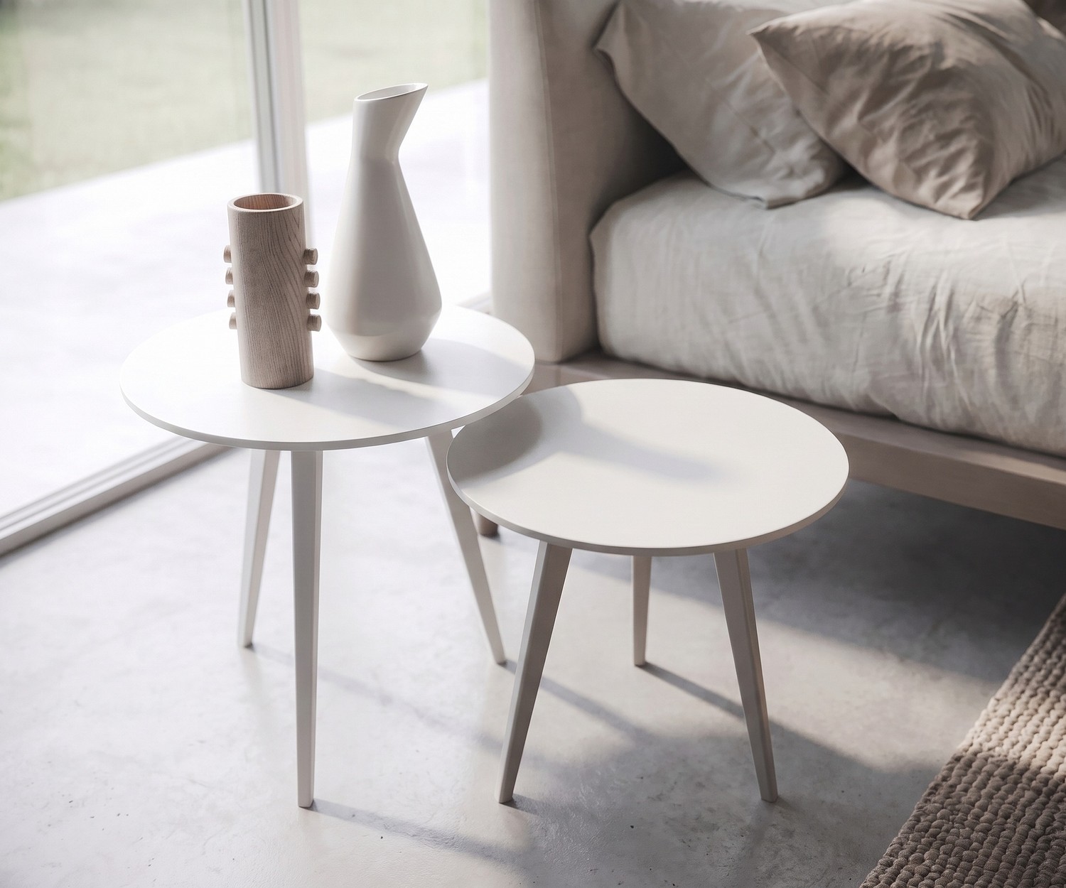 Side table for the living room Trio by Novamobili. Round white wooden nesting tables in a minimalist Scandinavian style.