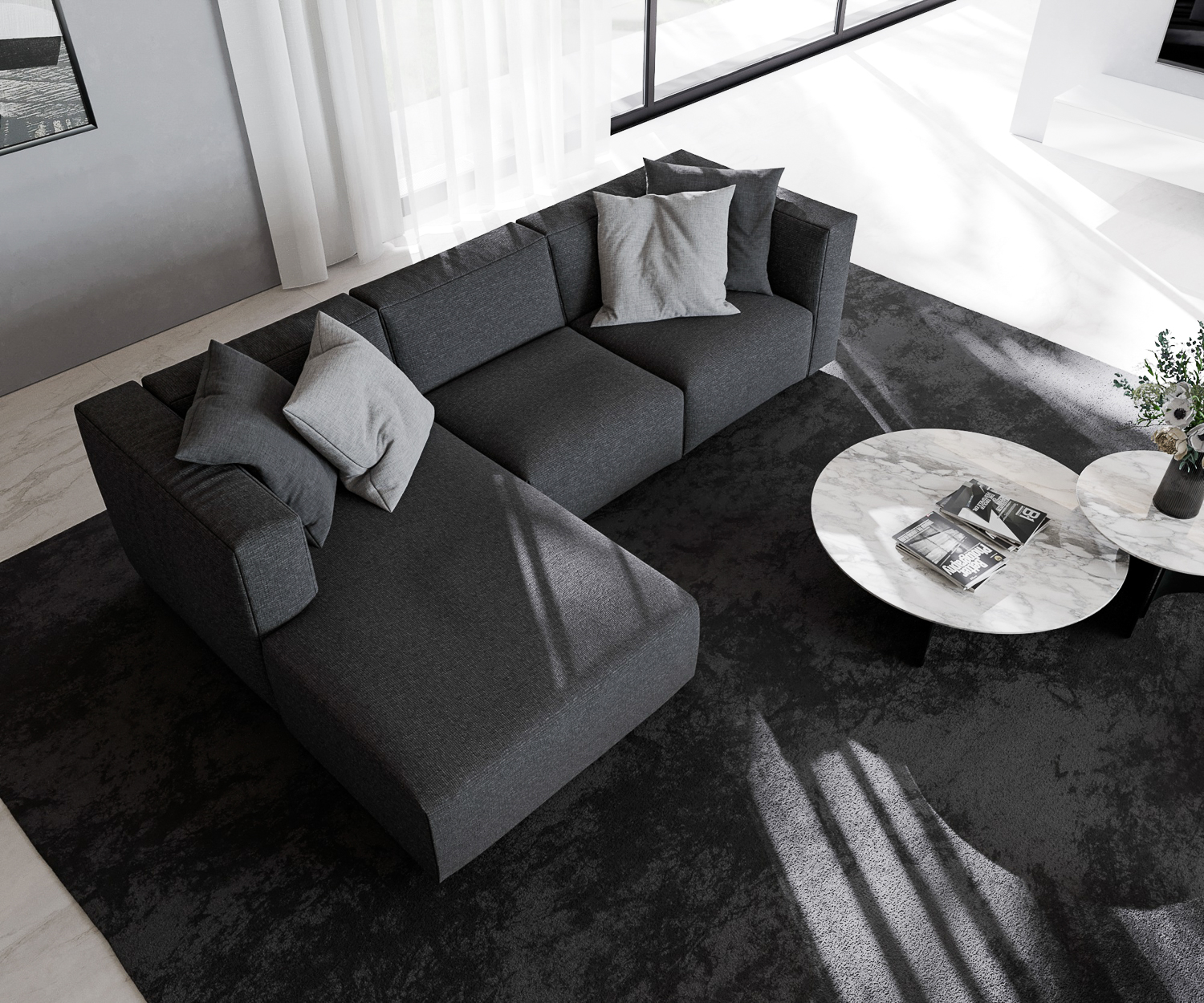 Schwarzes Prostoria Sofa Match L mit Recamiere von oben mit couchtisch in designer wohnung vor balkonfenster 2 sitzer dreisitzer