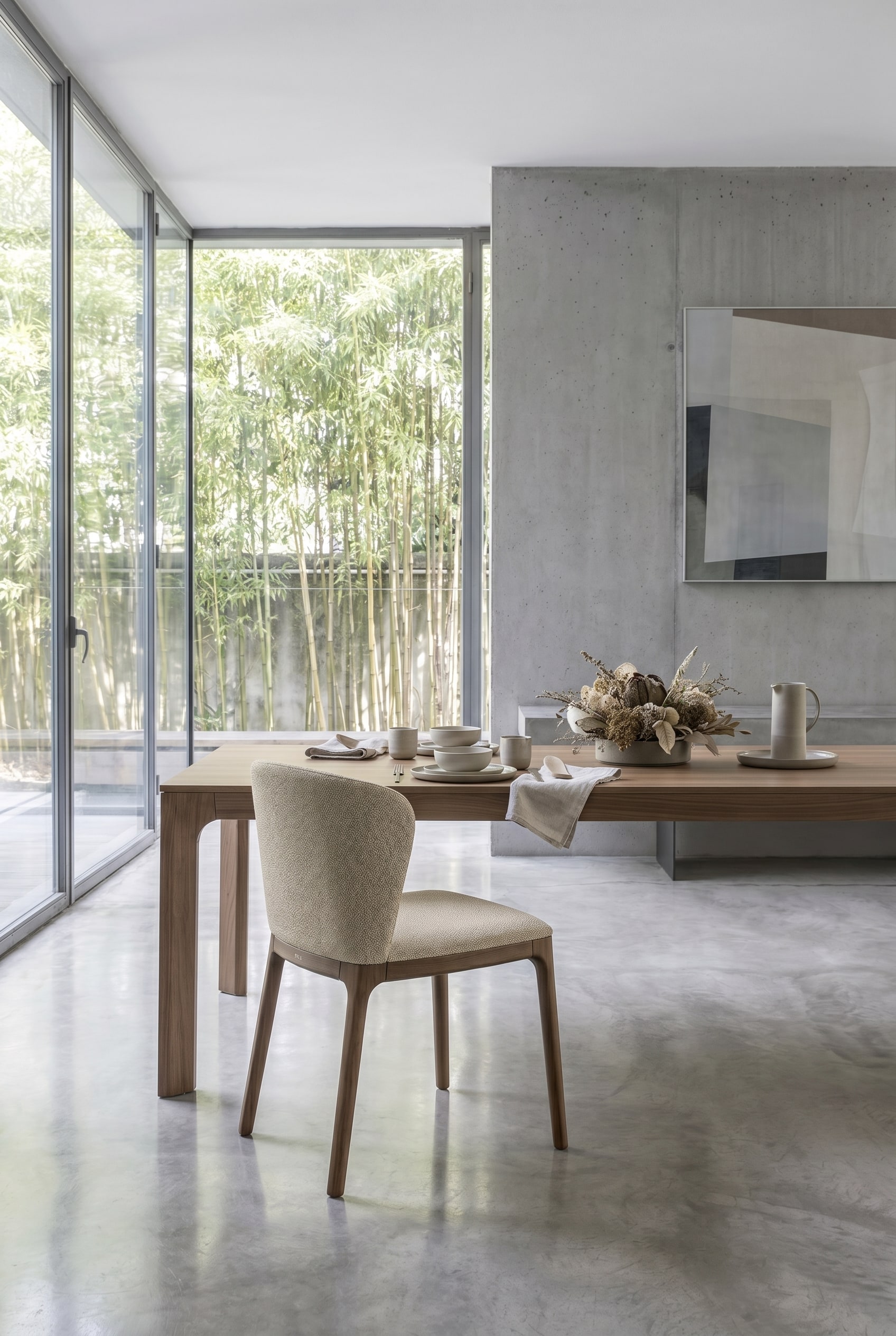 Minimalist dining room with Novamobili Navy chair in beige fabric in front of a large window facade