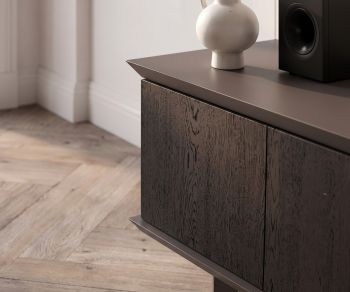 TV media lowboard Ozzio Brera in black oak for modern living rooms. Italian design sideboard with wood grain detail.