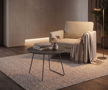 Novamobili Orbis coffee table as a living room side table next to an armchair, round dark table in a modern design