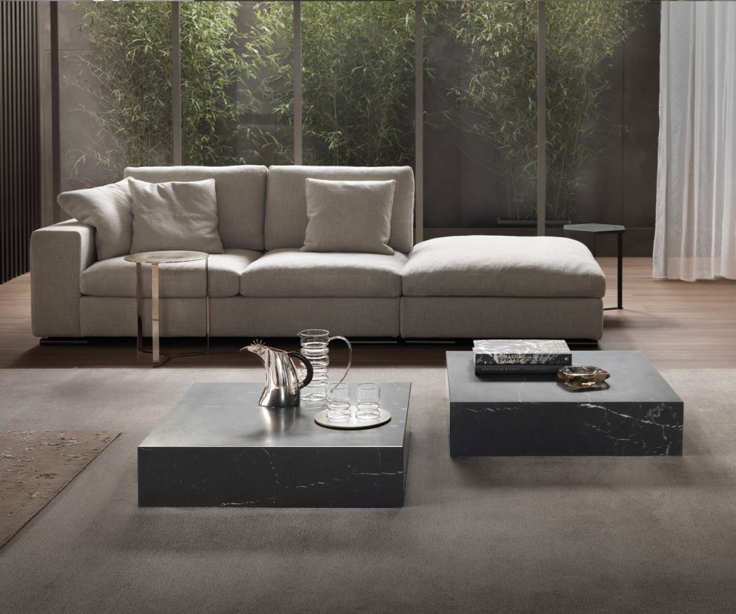 Marelli Designer sofa table duo in front of black marble couch