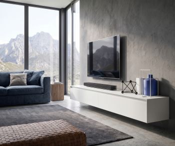 Floating TV lowboard Reverse by Novamobili in a minimalist living room with concrete wall