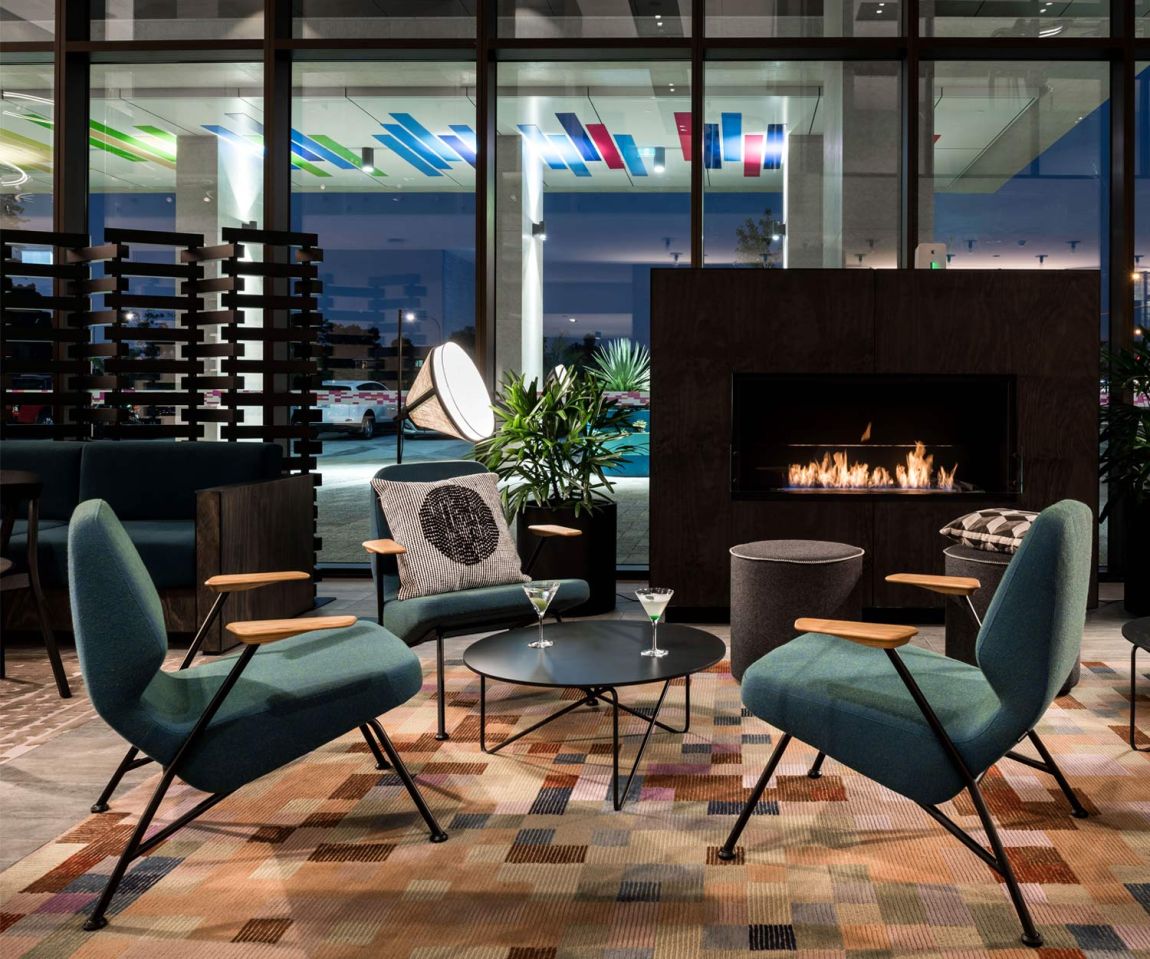 High-quality Prostoria Oblique designer armchair in green in the living room