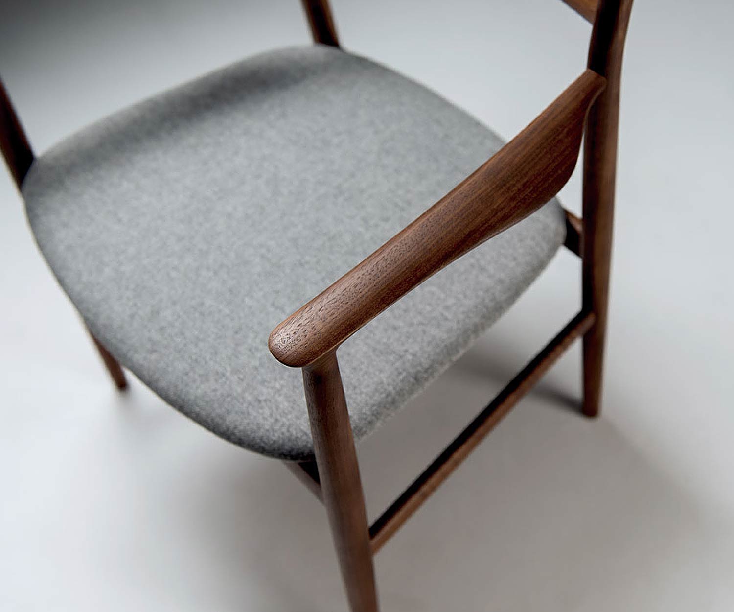 Modern Conde House Kamuy design armchair walnut upholstered in light grey