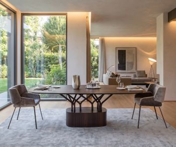 al2 wood-oo 001 a dining table in a modern dining room, oval wooden designer table with branch-like pedestal base.