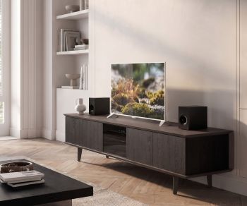 Ozzio Brera TV media lowboard in dark oak wood, stylish TV unit set up in a bright modern living room.