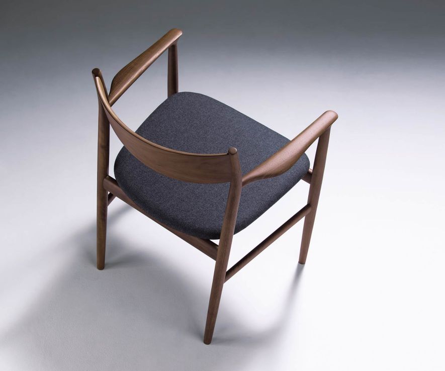 Conde House Kamuy Design armchair walnut upholstered in dark grey