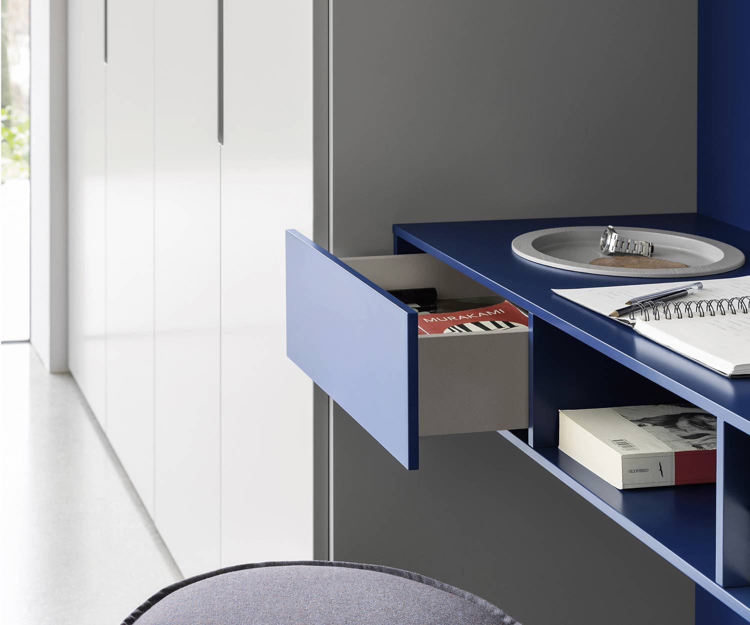 Bedroom wardrobe with desk and hutch with open drawer