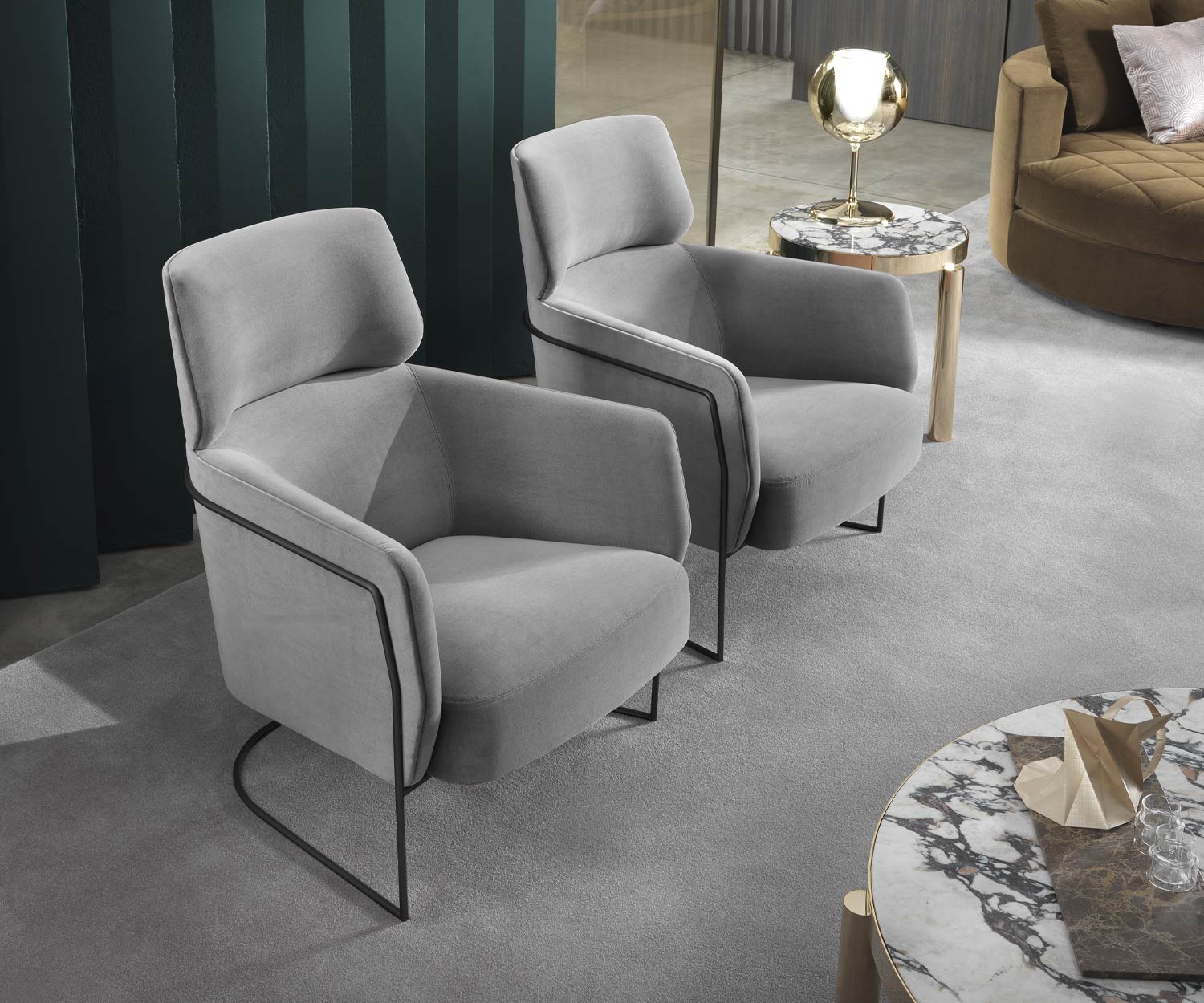 Light grey Nest lounge chair from Marelli black frame living room